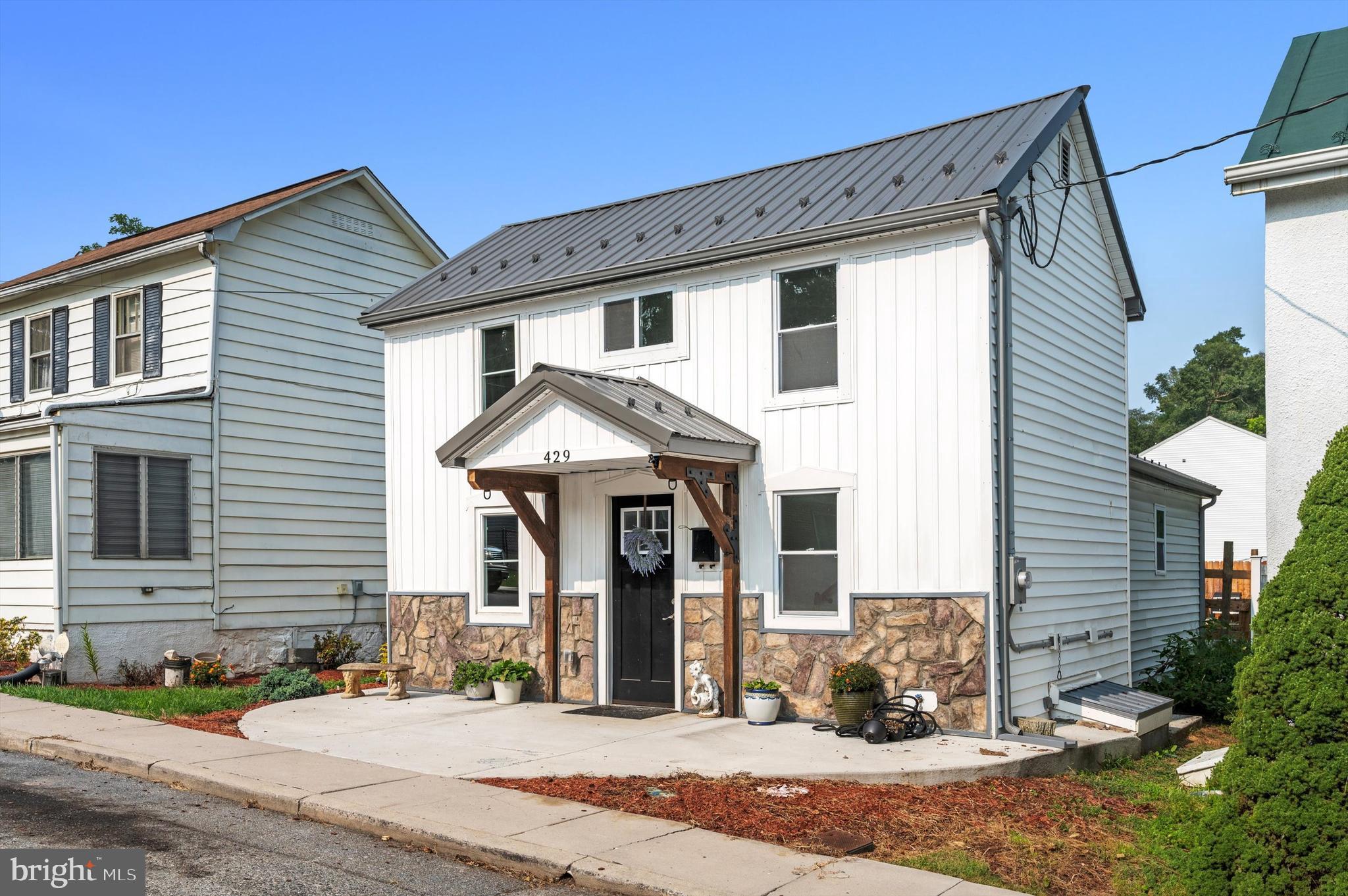 $10K PRICE ADJUSTMENT! This charming renovated home in downtown Charles Town sits in a very convenient in-town location, close to everything- Coffee Shops, Post Office, and Restaurants. This home packs a lot into a small space- A full primary suite with an ensuite bath upstairs with barn door and upgraded fixtures. On the main level, an additional bedroom and full bath complement a large kitchen/dining/living area that walks out to a fenced backyard with a concrete patio and a bonus grill area. An additional deeded parking area behind the back fence allows off-street parking for 2 cars in addition to the on-street parking in front. There is low-maintenance vinyl flooring throughout the home. Super efficient min-split heat pumps installed in 2022. New roof, windows, appliances, electric, and plumbing. All in 2022/2023. Would make a great vacation home or pied-Ã -terre. This updated, move-in ready home won't last long in Charles Town!