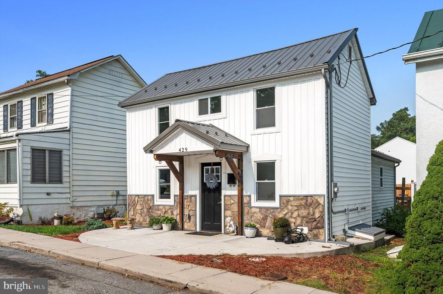 $10K PRICE ADJUSTMENT! This charming renovated home in downtown Charles Town sits in a very convenient in-town location, close to everything- Coffee Shops, Post Office, and Restaurants.  This home packs a lot into a small space- A full primary suite with an ensuite bath upstairs with barn door and upgraded fixtures.  On the main level, an additional bedroom and full bath complement a large kitchen/dining/living area that walks out to a fenced backyard with a concrete patio and a bonus grill area.  An additional deeded parking area behind the back fence allows off-street parking for 2 cars in addition to the on-street parking in front.  There is low-maintenance vinyl flooring throughout the home.  Super efficient min-split heat pumps installed in 2022.  New roof, windows, appliances, electric, and plumbing.  All in 2022/2023.  Would make a great vacation home or pied-à-terre.  This updated, move-in ready home won't last long in Charles Town!