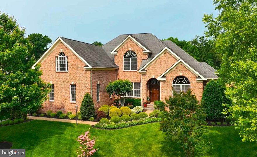 Welcome to this STUNNING CUSTOM Home in the SUPERB Gated Golf Community of Lake Manassas * The INCREDIBLE Setting offers PANORAMIC Views of the Golf Course, Pond & Trees from EVERY Level with Winter Views of Lake Manassas * This SPECIAL Home is in PRISTINE Condition Throughout & has been LOVINGLY Maintained by the Original Owners * From the STATELY ALL Brick Exterior to the BEAUTIFUL European Inspired Design, this Home has it ALL * The FANTASTIC Layout boasts OVER 6,200 Finished Square Feet featuring 10’ Ceilings & 8’ Doors across the Main Level * The GRAND Two-Story Entry Foyer opens to ELEGANT Formal Rooms through Arched Openings * The IMPRESSIVE Two-Story Great Room offers a COZY Gas Fireplace flanked by GORGEOUS Floor-to-Ceiling CUSTOM Built-ins & Walls of Windows offering LOVELY Views * The SMASHING Eat-in Kitchen features HANDSOME CUSTOM Cabinetry with Thoughtful Touches like Pull-out Drawers & Spice Racks, Hide-away Trash Bins & MORE * The SPACIOUS Main Level Study has even MORE Built-ins * The PRETTY Main Level Owner’s Retreat boasts STUNNING Views, a LUXURIOUS Bath, a Walk-in Closet with CUSTOM Organizers & Doors to the Deck * The Upper Level provides 3 NICE Sized Bedrooms, 3 Full Baths and an ENORMOUS Bonus Room offering Endless Possibilities * The BRIGHT & OPEN Walk-out Lower Level is EXCELLENT for Entertaining and also has GREAT Views of the Pond & Golf Course as well as French Doors to a Stamped Concrete Patio * From the FABULOUS Granite Wet Bar, VERSATILE Seating & Game Table Areas & Wide-plank Wood Floors this BIG Rec Room will be a Favorite Hang-out * There’s also a HUGE 5th Bedroom with a Walk-in Closet, a NICE Full Bath & AMPLE Storage Space * Other UPGRADES include: an Audio System with Built-in Speakers Throughout the Home, an OVERSIZED Garage with Storage Space & an EXPANSIVE Trex Deck off the Main Level with DUAL Electric Awnings * LUSH Landscaping & In-ground Irrigation System * WONDERFUL Gated Community with 2 Golf Courses, GREAT Amenities & Wegmans/Shopping just blocks away