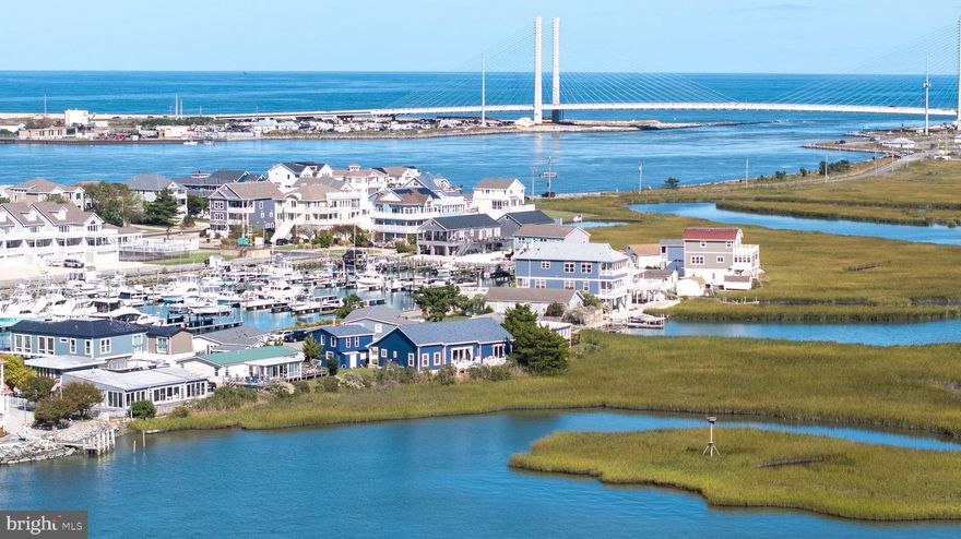 AMAZING VIEWS from this completely renovated rancher with garage apartment right on the Indian River Bay!  This home is located in the gated community of South Shore Marina in North Bethany, just a mere minutes walk to the Big Chill Beach Club and the Delaware Seashore State Park!  Inside you will find a tastefully appointed home with custom tiled showers, upgraded LVP flooring throughout, open floorplan and a beautifully appointed kitchen with quartz countertops, high end cabinetry and custom backsplash!  Views of the Indian River Bay abound from your living room and deck!  Ospreys, Blue Heron, Egrets and Ibises are just outside your back door!  The detached garage is a blank tapestry just waiting for its new owner to complete to their tastes!  A shower stall has already been installed along with a rough in for commode; new windows and lighting have been installed as well....just needs someone to put their own vision to work!  This home is only a 10 minute drive from Dewey Beach and downtown Bethany.  Lots to do whether surfing, fishing, camping, bird watching or just plain going to the beach!  LOW HOA's to boot too!  Make your appointment now to see this rare home!