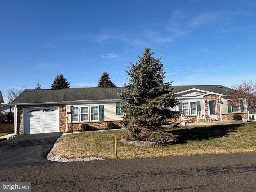 The largest model on one of the largest lots in Buckingham Springs. This Solebury model on a dead-end street has vaulted ceilings, 3 Bedrooms, 2 full Baths, Living room, Dining room, Large Kitchen with Breakfast room, Family room and a lovely  (12 x 24) Sunroom with a propane heater. The master suite has a walk-in closet and built in shelving / cabinets  with a master bath featuring a soaking tub , separate shower, double sink vanity, skylight and vaulted ceiling. This home has been lovingly maintained and has a replaced roof and newer HVAC system. The laundry room has a full sized utility sink and cabinets for storage .The oversized garage is dry-walled and carpeted and has a pull down stairs to attic storage.
The lot fee includes sewer, trash and common area maintenance, plus a clubhouse with an outdoor heated pool and spa, private bus service for shopping and regularly scheduled outings.
