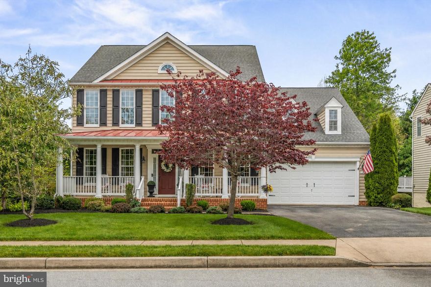 Beautifully maintained home in the highly desirable Sterling Glen community that truly shows like a model. The professionally landscaped yard create exceptional curb appeal, complemented by a gutter system with built-in leaf filters for added convenience and low-maintenance living.

Hardwood floors throughout the main level, this home offers an open layout perfect for everyday living and entertaining. The gourmet kitchen features upgraded appliances, granite countertops, and a large island that opens to the family room with a stunning stone gas fireplace. A bright morning room leads to a spacious wraparound maintenance-free deck—perfect for relaxing or entertaining.

Upstairs offers four generously sized bedrooms, including a spacious primary suite with hardwood floors, tray ceiling, huge walk-in closet, and a luxurious bath with soaking tub. A secondary bedroom offers added privacy with its own en-suite bath and walk-in closet, while the third and fourth bedrooms are equally spacious, each featuring walk-in closets for ample storage.

The finished walk-out basement features tall ceilings, a stone electric fireplace, wet bar with under counter refrigerator, and plenty of space for entertaining. Step outside to a lovely, new patio overlooking the peaceful backyard.