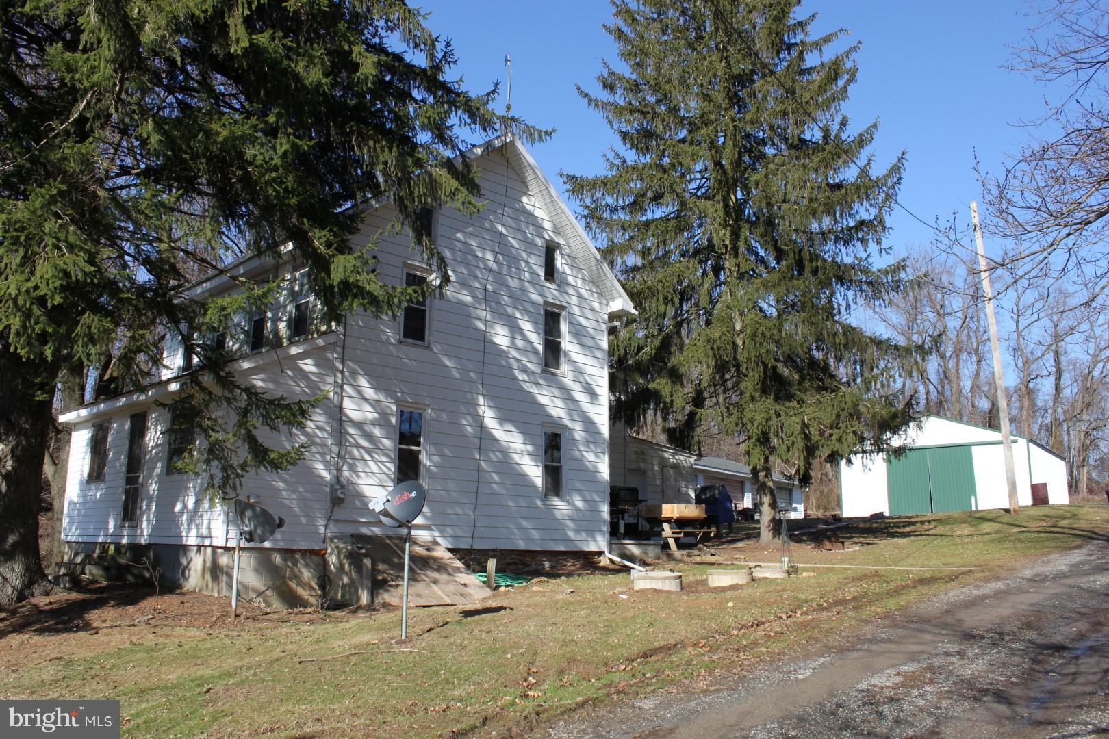 Remarkable 153 acre farm in ag preservation with 135 acres of high quality tillable land, 16 acres of woods, a 4 bedroom, 1 bath farmhouse, detached 3 car garage, 3,000 sq ft pole barn and an additional building right.