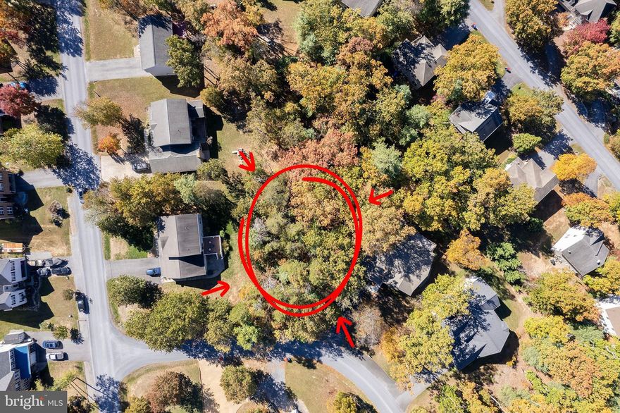 Have you been waiting for a relatively FLAT lot in Lake Holiday? This is your chance! This gorgeous lot on the quiet south side is backed by a small common area for a bit more privacy. You can bring your own builder, and can build as small as 1,000sf if one level, or for a two level you need 800sf on the main level and then at least 200sf upstairs. Currently the water/sewer connection is only $5k, and there is NO timeline for building! Take your time to build your dream house and enjoy the lake activities until then. (No camping on lots is allowed, you can build modular or stick, no trailers or manufactured homes.) Lake Holiday offers 3 beaches, clubhouse, sports courts, dog park, disc golf course, and so much more. Just 20 mins from Old Town Winchester!