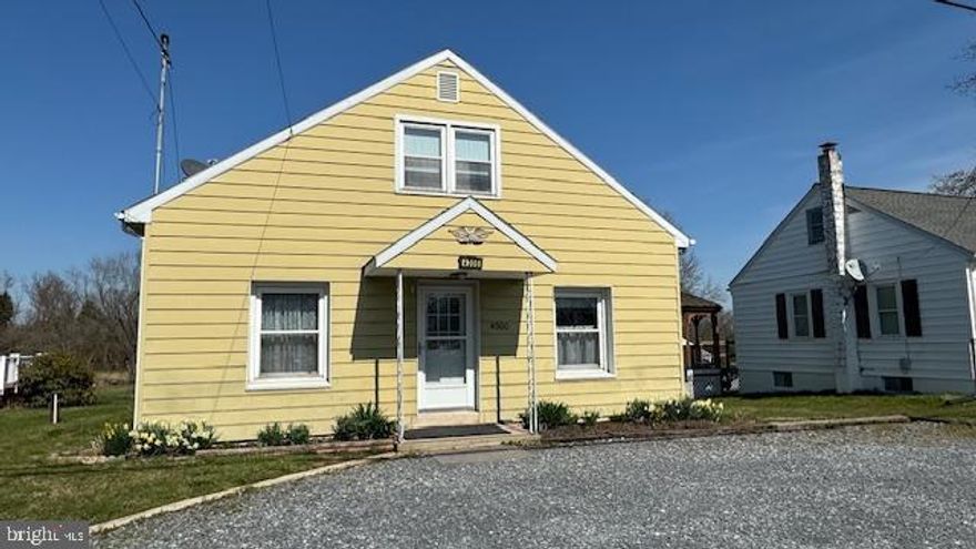 This adorable 4 bedroom detached home with large kitchen, living room  are ready for your personal touches.  Updated hall bath, & Laundry on main level.  Attic could be finished for more room.  Large rear deck overlooks yard that backs to woods.  Lots of potential.  4 car gravel drive.