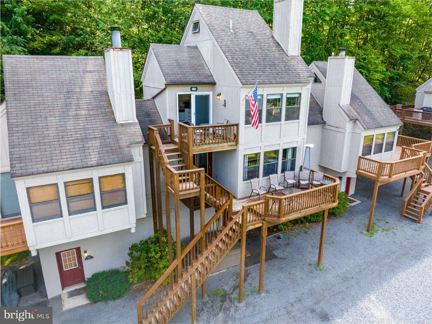 Are you seeking to immerse yourself in the heart of Deep Creek Lake's vibrant atmosphere? Look no further! This incredible condo, situated in the highly sought-after Traders Landing Community, offers the perfect blend of affordability and stress-free living. Prepare to be captivated by the breathtaking views that greet you, providing an expansive panorama of the surroundings. With recent updates including kitchen countertops and flooring, this unit exudes a fresh and modern feel. Featuring 2 bedrooms and 1 bathroom, this condo is designed to cater to your comfort. Additionally, the convenience of extra storage space allows you to safely stow away your kayaks, bikes, and other belongings. Step inside this cozy abode, and you'll be greeted by charming wood ceiling, a spiral staircase, and a delightful wood-burning fireplace that radiates warmth and coziness. The location is truly unbeatable, as you'll find Brenda's Pizzeria, Trader's Coffee House, Subway, and various retail shops just a short walk away. Furthermore, Wisp Ski Resort is merely minutes from your doorstep, allowing you to indulge in thrilling winter activities. Don't miss out on this fantastic opportunity to embrace the Deep Creek Lake lifestyle. Immerse yourself in the heart of all the action and make this exceptional condo your own. Call today!