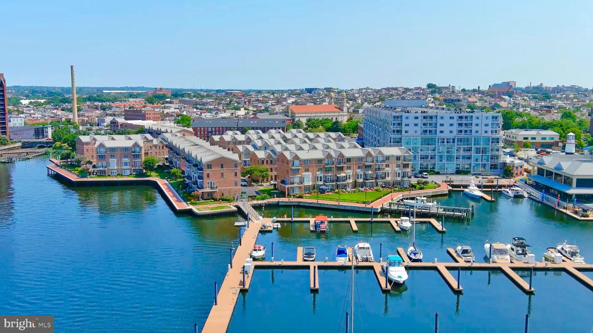 STEP INTO THIS RARELY AVAILABLE TOWNHOUSE IN CANTON'S PREMIER WATERFRONT GATED COMMUNITY, "THE MOORINGS." BOASTING OVER 3800 SQFT OF CUSTOM LIVING SPACE, THIS FOUR-LEVEL, 3 BEDROOM & 4.5 BATHROOM GEM INCLUDES AN ELEVATOR AND IS TRULY ONE OF A KIND. ENJOY EXPANSIVE WATER VIEWS OF FORT MCHENRY, LOCUST PT, FELLS PT, AND THE BALTIMORE HARBOR FROM TWO BALCONIES AND A PATIO THAT OPENS TO A LARGE GRASS AREA PERFECT FOR GATHERINGS WITH FAMILY AND FRIENDS. THE GOURMET KITCHEN IS A CHEF'S DREAM, FEATURING AN OVERSIZED GRANITE ISLAND, A 48" SUB-ZERO REFRIGERATOR, A 6-BURNER VIKING STAINLESS STEEL STOVE WITH A VIKING EXHAUST HOOD, A WINE COOLER, AND HARDWOOD FLOORS THROUGHOUT.
WITH A TWO-CAR GARAGE AND A TWO-CAR PARKING PAD, PARKING IS NEVER AN ISSUE. THIS EXCEPTIONAL HOME INCLUDES THREE GAS FIREPLACES AND INCREDIBLE CUSTOM BUILT-INS AND CABINETS ON EVERY LEVEL. THE FIRST-LEVEL FAMILY ROOM IS PERFECT FOR ENTERTAINING, COMPLETE WITH A WET BAR AND CUSTOM REFRIGERATOR, AND IT OPENS TO A WATERFRONT PATIO SURROUNDED BY BEAUTIFUL MARINAS. THE ENTIRE FOURTH LEVEL IS DEDICATED TO THE MAIN BEDROOM, OFFERING STUNNING SUNRISE AND SUNSET VIEWS. IT FEATURES CUSTOM CABINETS, A GAS FIREPLACE, AND AN OVERSIZED WALK-IN CLOSET. THE MAIN BATHROOM HAS A LARGE STAND-UP SHOWER WITH A BENCH AND AN OVERSIZED JETTED TUB TO RELAX IN.. A BEAUTIFUL CUSTOM WHITE VANITY PROVIDES AMPLE STORAGE WITH TWO SINKS.
THE THIRD LEVEL INCLUDES TWO EN-SUITE BEDROOMS, A LAUNDRY ROOM, AND AN OFFICE AREA. MODERN FEATURES INCLUDE DUAL-ZONED HVAC (REPLACED IN 2023), RECESSED LIGHTING THROUGHOUT, AND BRAND NEW PELLA WINDOWS INSTALLED IN 2023. THE KITCHEN ALSO BOASTS A NEWLY INSTALLED SUB-ZERO REFRIGERATOR. DON'T MISS THE CHANCE TO OWN THIS INCREDIBLE HOME IN "THE MOORINGS" AND ENJOY WATERFRONT LIVING AT ITS FINEST!