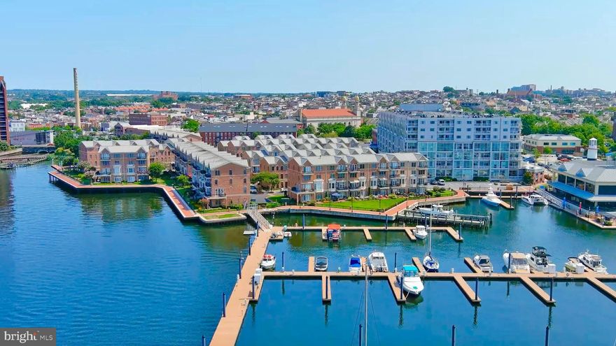 STEP INTO THIS RARELY AVAILABLE TOWNHOUSE IN CANTON'S PREMIER WATERFRONT  GATED COMMUNITY, "THE MOORINGS."  BOASTING OVER 3800 SQFT OF CUSTOM LIVING SPACE, THIS FOUR-LEVEL, 3 BEDROOM & 4.5 BATHROOM  GEM INCLUDES AN ELEVATOR AND IS TRULY ONE OF A KIND.  ENJOY EXPANSIVE WATER VIEWS OF FORT MCHENRY, LOCUST PT, FELLS PT, AND THE BALTIMORE HARBOR FROM TWO BALCONIES AND A PATIO THAT OPENS TO A LARGE GRASS AREA PERFECT FOR GATHERINGS WITH FAMILY AND FRIENDS.  THE GOURMET KITCHEN IS A CHEF'S DREAM, FEATURING AN OVERSIZED GRANITE ISLAND,  A  48" SUB-ZERO REFRIGERATOR, A 6-BURNER VIKING STAINLESS STEEL STOVE WITH A VIKING EXHAUST HOOD, A WINE COOLER, AND HARDWOOD FLOORS THROUGHOUT.

WITH A TWO-CAR GARAGE AND A TWO-CAR PARKING PAD, PARKING IS NEVER AN ISSUE. THIS EXCEPTIONAL HOME INCLUDES THREE GAS FIREPLACES AND INCREDIBLE CUSTOM BUILT-INS AND CABINETS ON EVERY LEVEL. THE FIRST-LEVEL FAMILY ROOM IS PERFECT FOR ENTERTAINING, COMPLETE WITH A WET BAR AND CUSTOM REFRIGERATOR, AND IT OPENS TO A WATERFRONT PATIO SURROUNDED BY BEAUTIFUL MARINAS. THE ENTIRE FOURTH LEVEL IS DEDICATED TO THE MAIN BEDROOM, OFFERING STUNNING SUNRISE AND SUNSET VIEWS.  IT FEATURES CUSTOM CABINETS, A GAS FIREPLACE, AND AN OVERSIZED WALK-IN CLOSET. THE MAIN BATHROOM HAS A LARGE STAND-UP SHOWER WITH A BENCH AND AN OVERSIZED JETTED TUB TO RELAX IN.. A BEAUTIFUL CUSTOM WHITE VANITY PROVIDES  AMPLE STORAGE WITH TWO SINKS.

THE THIRD LEVEL INCLUDES TWO EN-SUITE BEDROOMS, A LAUNDRY ROOM, AND AN OFFICE AREA. MODERN FEATURES INCLUDE DUAL-ZONED HVAC (REPLACED IN 2023), RECESSED LIGHTING THROUGHOUT, AND BRAND NEW PELLA WINDOWS INSTALLED IN 2023. THE KITCHEN ALSO BOASTS A NEWLY INSTALLED SUB-ZERO REFRIGERATOR. DON'T MISS THE CHANCE TO OWN THIS INCREDIBLE HOME IN "THE MOORINGS" AND ENJOY WATERFRONT LIVING AT ITS FINEST!