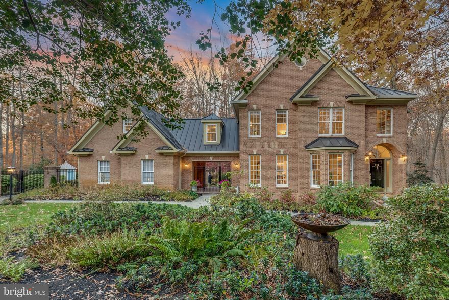 The Crown Jewel of Eagles Passages!   A mini private estate with all the benefits of subdivision living.  Spectacular 2023 Renovation with Gourmet Kitchen including all NEW kitchen cabinets custom made by Signature, starlight quartz counter tops, antique white backsplash, appliances, lighting, bar area with sink and oak hardwood flooring.  A NEW 50+ year metal roof installed (2016/2017).  Freshly painted home consists of 5 bedrooms, 4.5 baths (all updated), full finished basement with walkout to brick patio and separate private entrance.  3 wood burning fireplaces.  9' ceilings on main and lower levels.   8'-11' ceilings on the upper level.  Remote controlled shades for living / dining room windows.  Access to the second floor bedrooms from the foyer is via the custom built octagon shaped stairway with a 2 story ceiling and a generous window flank stairway that provides inviting views of the surrounding forest.  A second stairway provides access to the kitchen area.  The Primary Bedroom has a coffered ceiling, wood burning fireplace, extensive upgraded bathroom with new floor tiles (heated flooring), walk in shower, floor and wall tile, frameless glass shower door, sinks, vanities with white opal marble tops, tub and fixtures.  Three additional bedrooms and 2 full updated baths.   Bonus room outside the 4th bedroom.  Two laundry areas - upper level and lower level.  The Lower Level with full walkout to a brick patio has a finished family room, 5th bedroom, full bath, a pantry (plumbed for a bar or sink), a laundry room and storage area.  This space could function as an office, in-law suite or Au Pair.  A generous deck with "Sunsetter" awning on the rear side of the house is accessed from the great room.  The deck overlooks a pond.  Stone paths thru the garden allow for a calming walk thru mature shrubs and ornamental trees that provide color almost year round.  The garden is fenced with 6' high metal fencing and a 8'-10' brick wall with a gate to access the surrounding forest and community open space.  Multiple hardscape planters and patios adjacent to the driveway provide outdoor living space for entertaining.  Recently installed two new garden structures.   A "She shed" could serve as a detached office as electricity could easily be extended from other locations  within the garden.  All new outdoor lighting by Hinckley.  Attached 2 car garage (new doors) tastefully finished with custom steel cabinets, overhead powered storage lifts and vinyl floor tiles.  The community offers a centralized recreation area with pool and open play areas.  There is a community crab and fishing pier located within the development along the west side of the South River.  Canoe / kayak / SUP launch access.  Conveniently located to Annapolis, Baltimore and Washington, D.C.