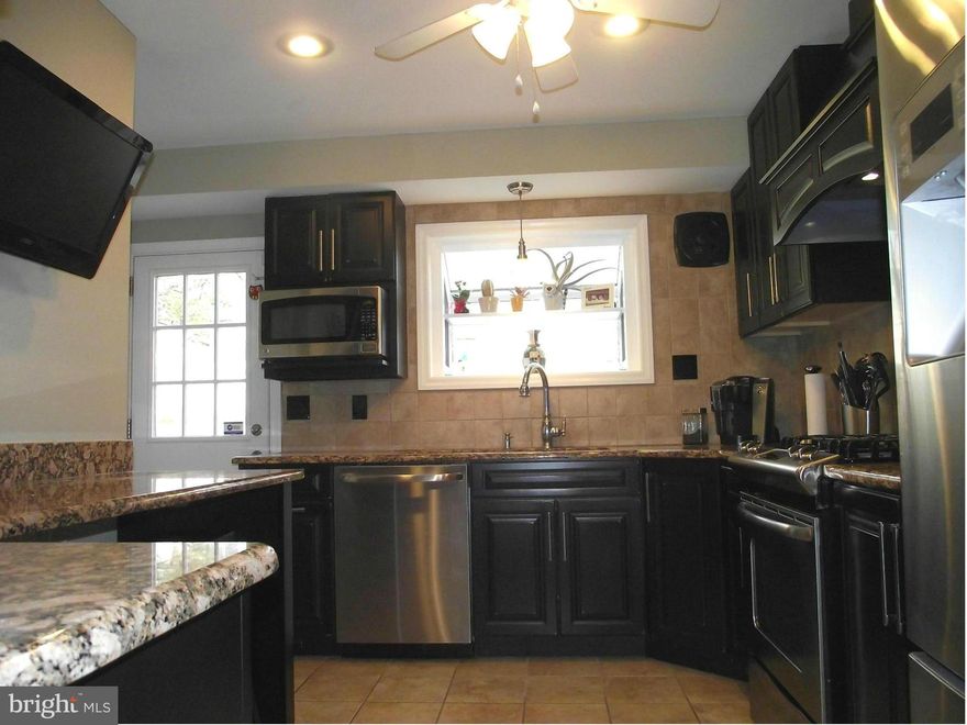 SHAKEY CONTRACT-Current buyer must settle by June 6th.  Gorgeous gourmet kitchen-Thomasville cabinetry, granite counters, gas stove, Kohler pot filler, ceramic backsplash & flooring.  Amazing master bath w /whirlpool tub plus 2 more beautifully updated full baths! Gleaming wood flooring. Lower level family rm & gym area.  Fenced backyard. Baseball field/school playground across street.