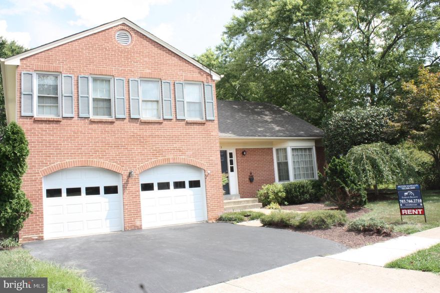 Price reduced for quick rent. no price compared! LOCATION!! LOCATION! LOCATION! Beautiful TRADITIONAL STYLE HOME WITH SOARING CEILINGS, HARDWOOD FLOORS, LARGE EAT-IN KITCHEN, FAMILY ROOM WITH A DELIGHTFUL BRICK FIREPLACE,LOWER LEVEL REC ROOM, EXTENSIVE DECKING AND A TWO CAR GARAGE! GREAT LOCATION!