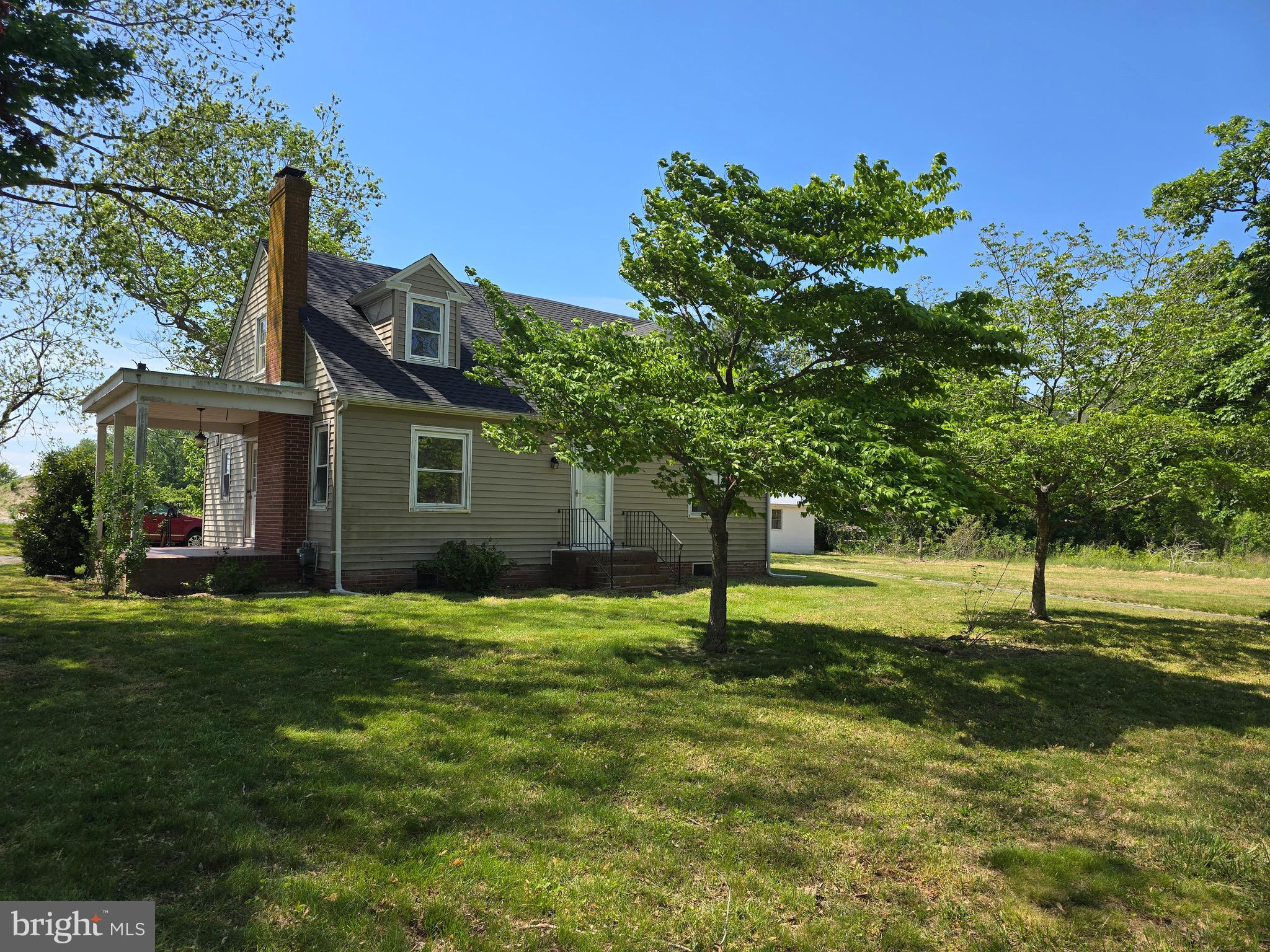 Classic Mid 20th Century 2 story Cape Cod with full Basement. This 1530 sf home is situated on a nicely sloped lot that is over 1.1 acres, with mature Hardwood trees, (Walnut, Pecan) and a circular paved driveway. This home has been recently renovated, a totally new kitchen with soft close cabinets, granite countertop, & stainless steel appliances. Replacement windows, with vinyl luxury plank flooring in the entire first floor. With redone bathrooms, new light fixtures, as well as a new roof! The home also Features 9 foot ceilings on the first floor, as well as a wood burning fireplace in the large living room. The
first floor features 2 bedrooms, 1 bathroom, Living Room, Dining Room, & Kitchen. The 2nd Floor a bedroom, bathroom and sitting area. The full basement access is from inside the home adjacent to the kitchen (over 1000sf/french drain system.) Although the home is classic in design, it has a modern feel and look. There is a 26 x 40 block garage with 2 overhead doors and scenic views! Last but not least, no HOA and no city taxes!
