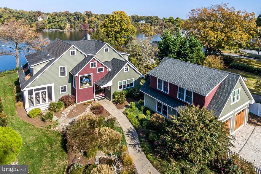Fabulous waterfront home. Unique, custom built home w/ views of the South River. Open floor plan, Brazilian cherry flrs, granite counters, 2 screened porches, custom landscaping, hardscape & fenced grounds on 3/4 acre. 4 Ensuite bedrooms plus 900 sq ft finished space above oversized detached garage. Unfinished basement.