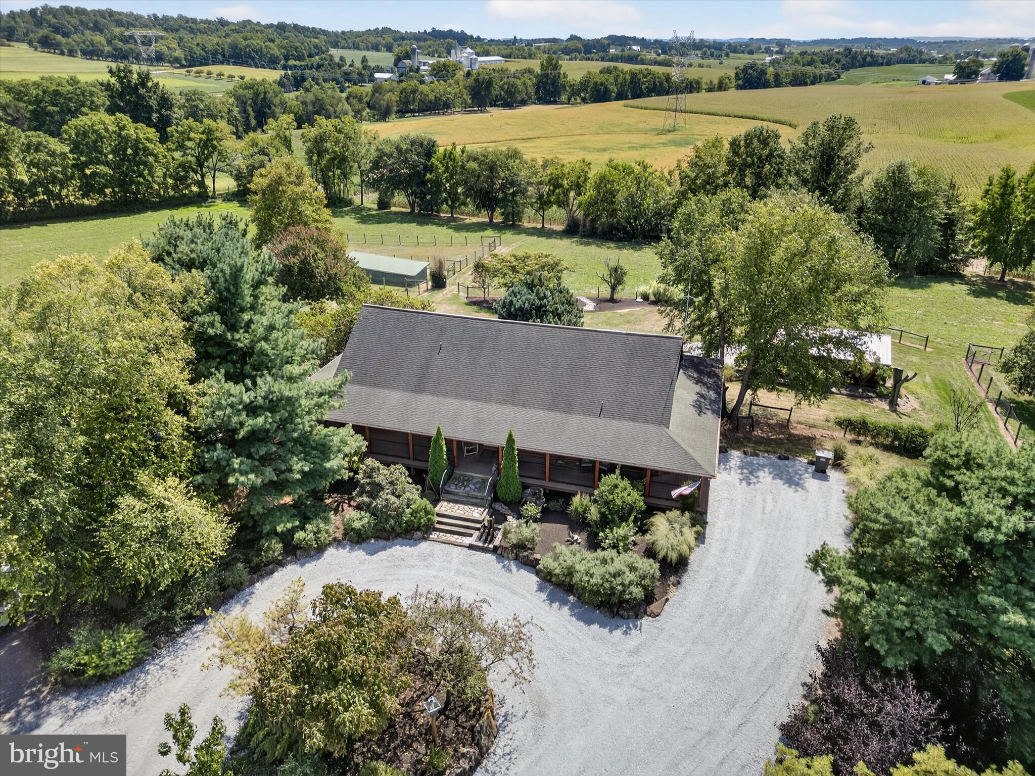 Check out this secluded log home with a covered wraparound porch situated on 7+ acres. The great room offers towering cathedral ceilings with a loft, exposed beams and a stone fireplace. The first floor primary suite offers another gas fireplace, full bath, walk in closet and direct access to the covered porch. There are numerous outbuildings for your animals and comes complete with automatic watering stations. The majority of the property is fenced and gated. This one will not last long!