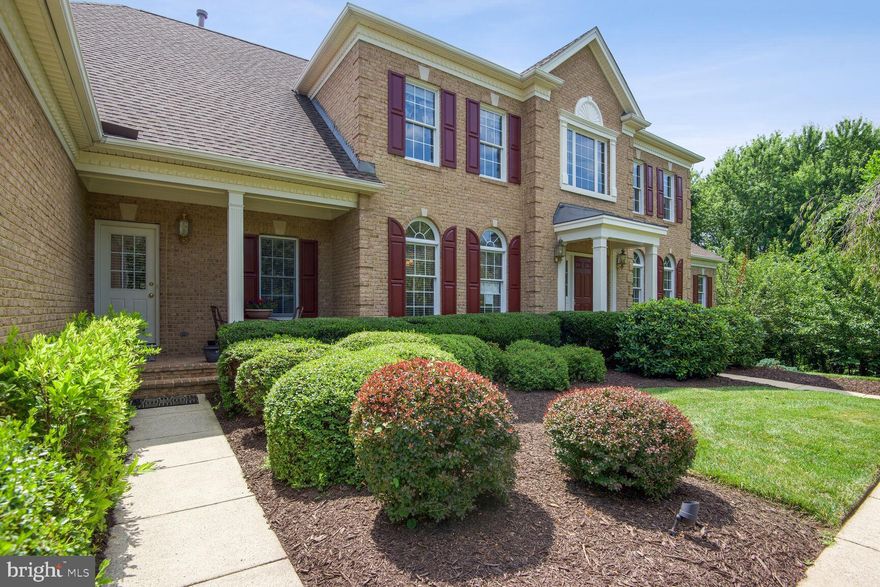 Stately home in the gated community of Dominion Valley Country Club with a total of 6400 square feet, 4 bedrooms, 5 full baths and 1 half bath and 3 car-garage.

The main level features hardwood floors throughout that seamlessly connect the living and dining rooms, study and gourmet kitchen, making it perfect for everyday living and entertaining. A sunroom with a palladium window is just off the living room. The gourmet kitchen has a large center island with gas cooktop, granite countertops, large breakfast room, wall of windows and a french door leading out to a spacious deck with a staircase leading to the backyard.

On the upper level  you’ll find the primary bedroom suite with a large walk-in closet and sitting area.   The primary bath features two separate vanities, large soaking tub and a separate shower.  Three more bedrooms are spacious and each have their own bathroom. A back staircase leads down to the kitchen.

This all brick home offers a three car garage and Newly Finished basement to include a large sitting area, full bath, two storage areas (one could be 5th bedroom) french double doors that walk out to level, private backyard, beautiful LVP flooring and lots of natural light. Mature landscaping offers ultimate privacy from the deck and backyard with views of several ponds with fountains and a gazebo. Brand New HVAC (June 2023).

Residents of the gated community of Dominion Valley Country Club enjoy access to fantastic amenities, including 18-hole championship Arnold Palmer Signature Golf Course, dining rooms, fitness center, basketball and tennis courts, three pools and clubhouse. Enjoy the convenience of nearby shopping, dining, and entertainment.