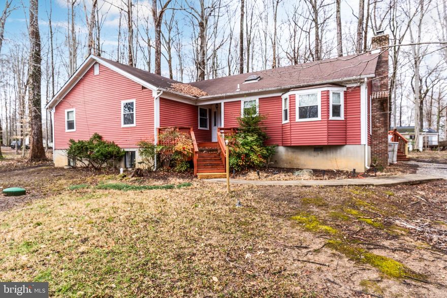 Oversized single family home for rent in the heart of Bowie! Freshly painted throughout! Basement has new laminate flooring! Living room features stone hearth wood burning fireplace! Open kitchen features brand new kitchen cabinets and granite countertops! Spacious master bedroom suite with ensuite bathroom! Three more generous sized bedrooms with a full bathroom round out the main level! Open basement features a fifth bedroom/office and a full bathroom! Large wraparound deck is perfect for entertaining!  No water bill as the property is on well and septic! Close to route 50, 301 and 3! Minutes to DC! Come and visit today!