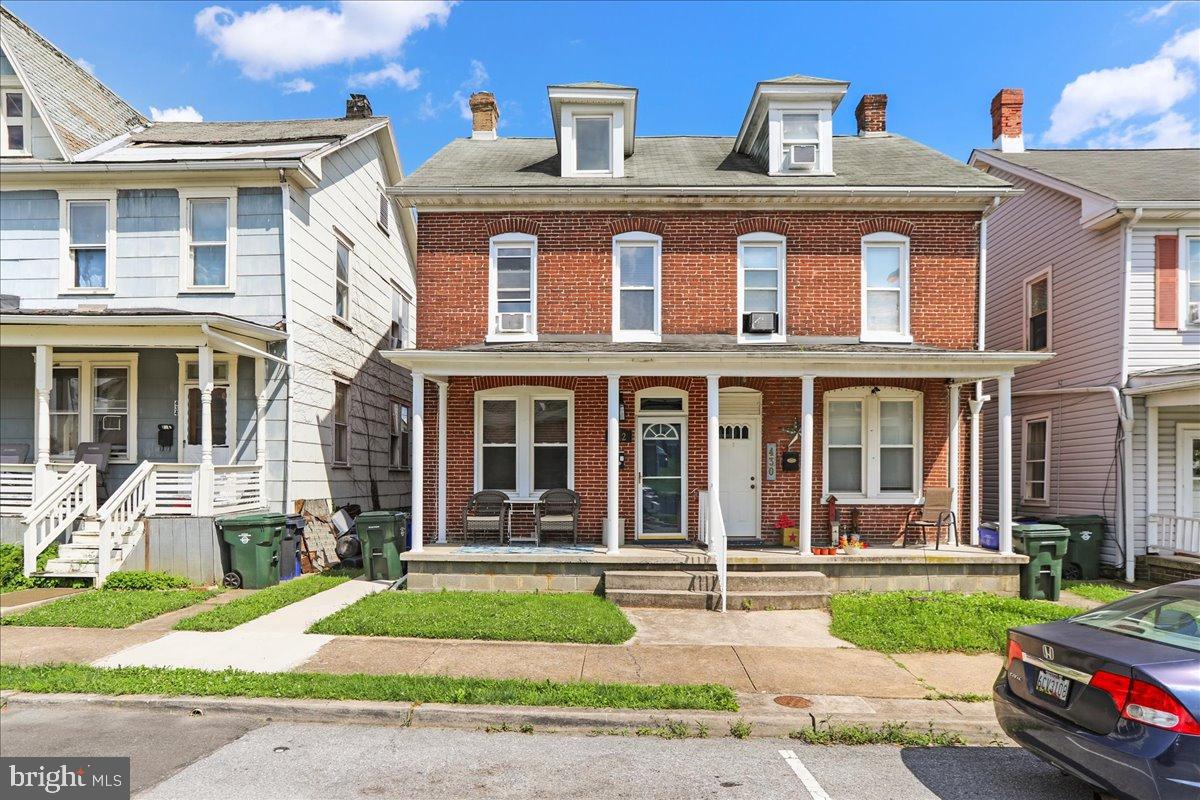Discover the perfect blend of modern convenience and timeless character in this beautifully renovated duplex located within the City of Hagerstown. From the original pocket doors to the fresh updates throughout, this home offers both style and functionality. Step into a bright and open main level featuring a spacious living room, a stunning new kitchen with granite countertops, a center island, and open-concept flow—perfect for entertaining. The main level also includes a full bath, convenient laundry area, and a screened-in rear porch that leads to a fully fenced backyard with private off-street parking. Upstairs, you’ll find three generously sized bedrooms and a beautifully updated full bath with a walk-in shower. A finished third-floor bonus room serves as a fourth bedroom, home office, or flex space to suit your needs. The basement is partially finished, offering additional storage or recreational space. Whether you're a homeowner or investor, this turnkey property offers charm, updates, and location all in one.