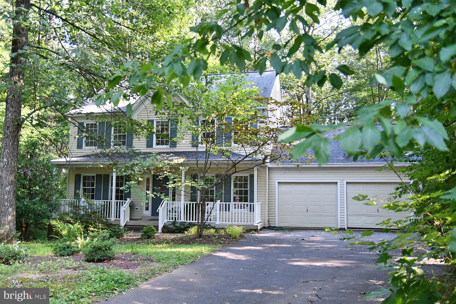 Lovely 2-story colonial on large cul-de-sac with front porch and front entry 2-car garage. Beautiful wooded homesite with deck overlooking the trees. Kitchen w/island. Breakfast nook. Family room. Living Room and Dining Room. 4-Bedrooms and 2-Baths upstairs. Rec Room, Office and Full Bath in Lower Level with side access door. Extra refrigerator and freezer in garage do not convey. Lovely quiet neighborhood.