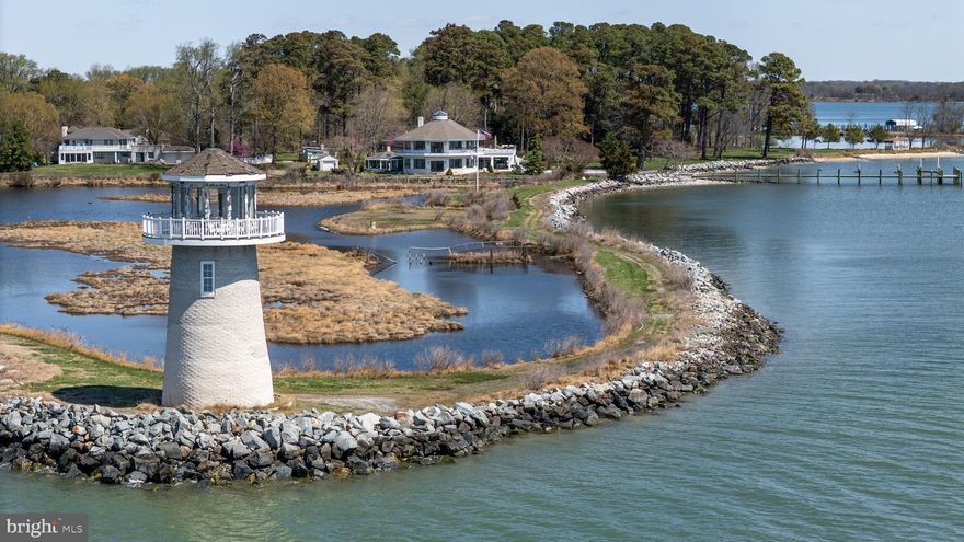 This is a true coastal retreat, from its stunning exterior to its thoughtfully designed living spaces. A one-of-a-kind waterfront estate, the property offers more than 2,000 feet of shoreline and sits on 5.4 private acres at the end of Kilby Point. Surrounded by water on both the Wye River and Eastern Bay, this exceptional home captures endless panoramic views in every direction. And yes—how many people can say they own a lighthouse?

The home has been completely renovated down to the studs, blending timeless coastal charm with modern convenience. Interior features include shiplap walls, beamed ceilings, new flooring, and beautifully reimagined living spaces throughout. The new kitchen is a showpiece, featuring quartz countertops, a large island, and Café appliances. A sprinkler system has also been added for peace of mind.

Designed to maximize its breathtaking setting, the home offers multiple living and entertaining spaces, including a game room, office, and dramatic 360-degree rooms with incredible views of the surrounding water and wildlife. There are four bedrooms, five full baths, and two half baths, all fully renovated with walk-in showers, elegant tile work, and stylish vanities. The primary suite is especially luxurious, featuring separate his-and-hers bathrooms.

Outdoor features are just as impressive, with a sand beach, rip-rapped shoreline, private pier with lift and electric, new pool decks, and a private setting that feels both peaceful and extraordinary. Additional upgrades include new siding, rails, septic, and a redesigned garage that has been incorporated into the home’s layout with glass doors, creating even more functional living space.

If you are searching for a waterfront property that feels truly special—distinctive, private, and unforgettable—this is it.