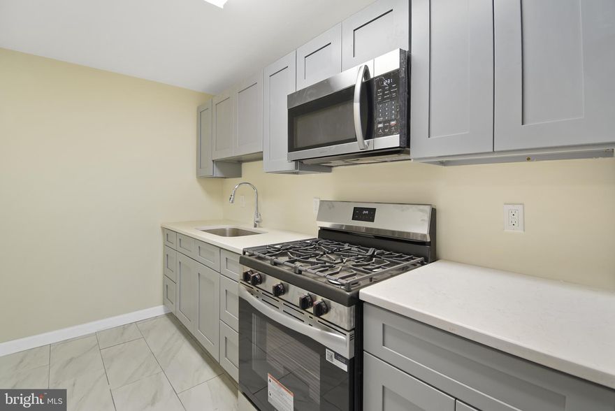 Welcome to 202 Golf Rd, a beautifully updated interior row home nestled in the sought-after Lansdowne Park section of Darby. This 3-bedroom, 1-bathroom gem offers a perfect blend of modern updates and classic charm, making it an ideal choice for first-time buyers or anyone seeking comfortable living. Step inside to discover the recently refinished gleaming hardwood floors that flow throughout the main and upper levels. Freshly painted in neutral tones, the home is bright and inviting, ready for you to make it your own. The updated kitchen features durable tile flooring, grey cabinetry and stainless steel appliances, including a refrigerator, gas stove and microwave—perfect for preparing your favorite meals. The remodeled bathroom boasts a new tub with a stylish tile surround and a tiled floor, offering a spa-like retreat. Replacement windows throughout the home provide energy efficiency and added comfort. Enjoy the outdoors on the front patio and fenced-in front yard, ideal for your pup or for relaxing. A driveway offers convenient one-car parking out back, plus the property has a large partially fenced-in rear yard. Additional highlights include washer/dryer hookups, a utility tub in the basement, and forced-air gas heating. Don't miss your opportunity to own this move-in-ready home. Schedule your tour today! One of the owners is a licensed real estate salesperson in the state of Pennsylvania.