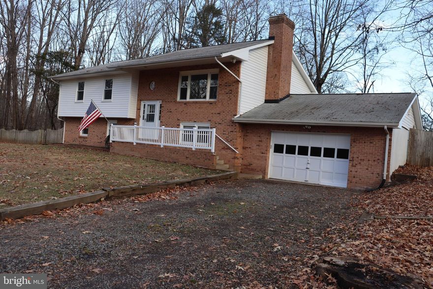 A nice slice of the pie, a little bit of country living in a commuter friendly location! Close to commuter arteries: I66, Routes 29, 28, 50, 15 & 17. Dulles International Airport,  Reagan National Airport, VRE Manassas Station, and Amtrak Culpeper Station.
<P> Springtime will bring a green curtain to the property for total privacy. Enjoy out door living on a little over one and a half acres. Morning coffee on the covered porch, evenings by the pool.
<P> Walk through the front door to a warm inviting home with so much natural light! The hardwood floors shine throughout the main level. The warm wood cabinets in the kitchen are accented with modern hardware and light bright granite counter tops. Add a couple of stools for more seating. Stainless steel appliances and a pantry for extra storage. All open to a nice size dinning area. There is a huge deck off the kitchen over looking the pool.
<P> The family room offers a nice view out of the large bay window. Down the hall are three bedrooms with plenty of natural light and closet space. There is a full hall bath, with the primary having its own private bathroom.
<P> The lower level offers a second family room with a brick accent wall. A fourth bedroom and full bath adds so much more living space.
<P> Outdoor living for all.........Open flat front yard,  fenced in side yard, fenced in pool area.
<P> ALL THIS WILL BE UNDER A BRAND NEW ROOF BEFORE CLOSING!