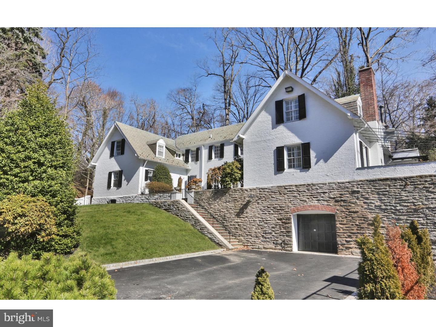 Extraordinary restoration of exceptional Chestnut Hill parkside property. This four bedroom, three full baths, two half baths single with garage, guest house, tennis court, and three-acre lot bordering Fairmount Park, has all you want in a city house with a country feel. Located on Rex Ave, one of Chestnut Hill's premier streets, puts you within walking distance of everything: commuter rails, shopping and entertainment on Germantown Avenue, and the wonder of nature in the largest in-city park in the country. Completely renovated by the present owners, every decision was made with the utmost taste and care. Transformed into a modern, beautifully appointed home, this property boasts versatile and abundant first floor living space that will wow you at every turn. The first floor consists of large formal living room with fireplace and built in book cases, a spacious family room with another fireplace and exceptional views outside, an elegant dining room, and the requisite kitchen for eating in and hanging out, complete with LaCornue range. The completely renovated guesthouse, with one bedroom and full bath, living room and kitchen, offers additional living space for many uses. The recent renovation was an unqualified labor of love. The stately, circa 1920, home sits above terraced grounds with bluestone patios, dry laid stone walls, walkways throughout the property, and mature landscaping that has been restored as well. This rare Chestnut Hill property provides all that today's buyer wants without any superfluousness. It is a must see!