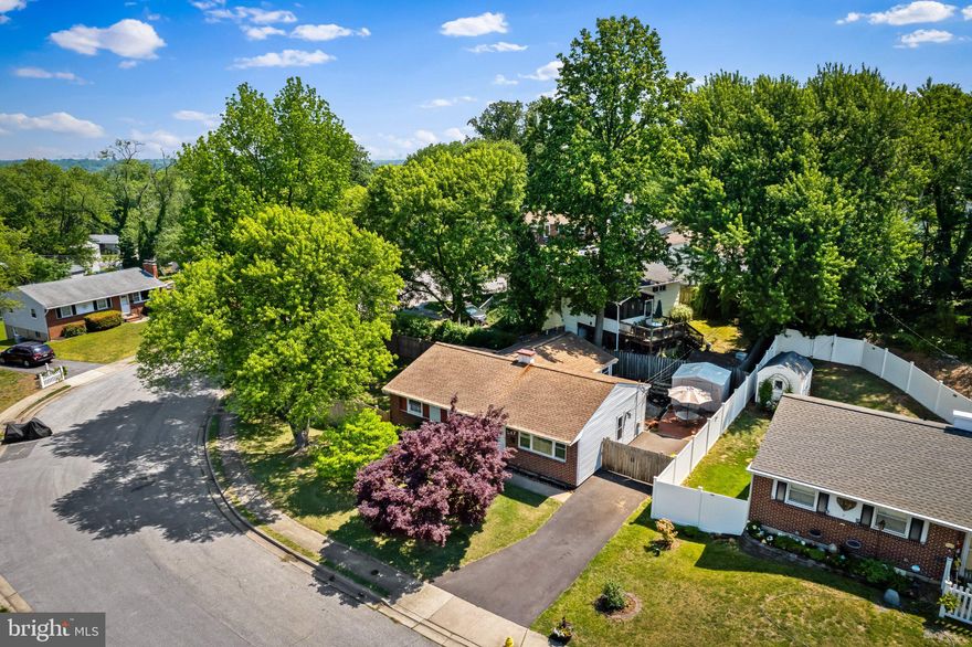 Welcome to this beautifully updated red brick home that has been dramatically improved over the last six years, blending timeless charm with modern upgrades throughout. Since 2020, this home has undergone extensive renovations including refinished hardwood floors, an updated kitchen with granite countertops and stainless steel appliances, recessed lighting, renovated main level bathroom, new fully finished basement with a full bath, HVAC system, hot water heater, updated six panel doors, and an expanded driveway with extended parking pad.

The main level offers three spacious bedrooms along with a renovated full bathroom. The bright and updated kitchen opens to the dining area, creating a functional layout for both daily living and entertaining. Just off the dining room is a sunroom that overlooks the backyard and provides direct access to the paver patio, creating the perfect indoor and outdoor flow.

The fully finished lower level adds exceptional flexibility with a large recreation room, dedicated gym space, additional den or potential bedroom, and a beautifully updated full bathroom. There is also a substantial storage and laundry area offering excellent functionality.

Situated on a large corner lot, the exterior provides multiple areas to enjoy. The expansive side yard is ideal for playtime, pets, or entertaining guests, while the rear and side privacy fencing create a secluded outdoor setting perfect for relaxing or hosting gatherings.