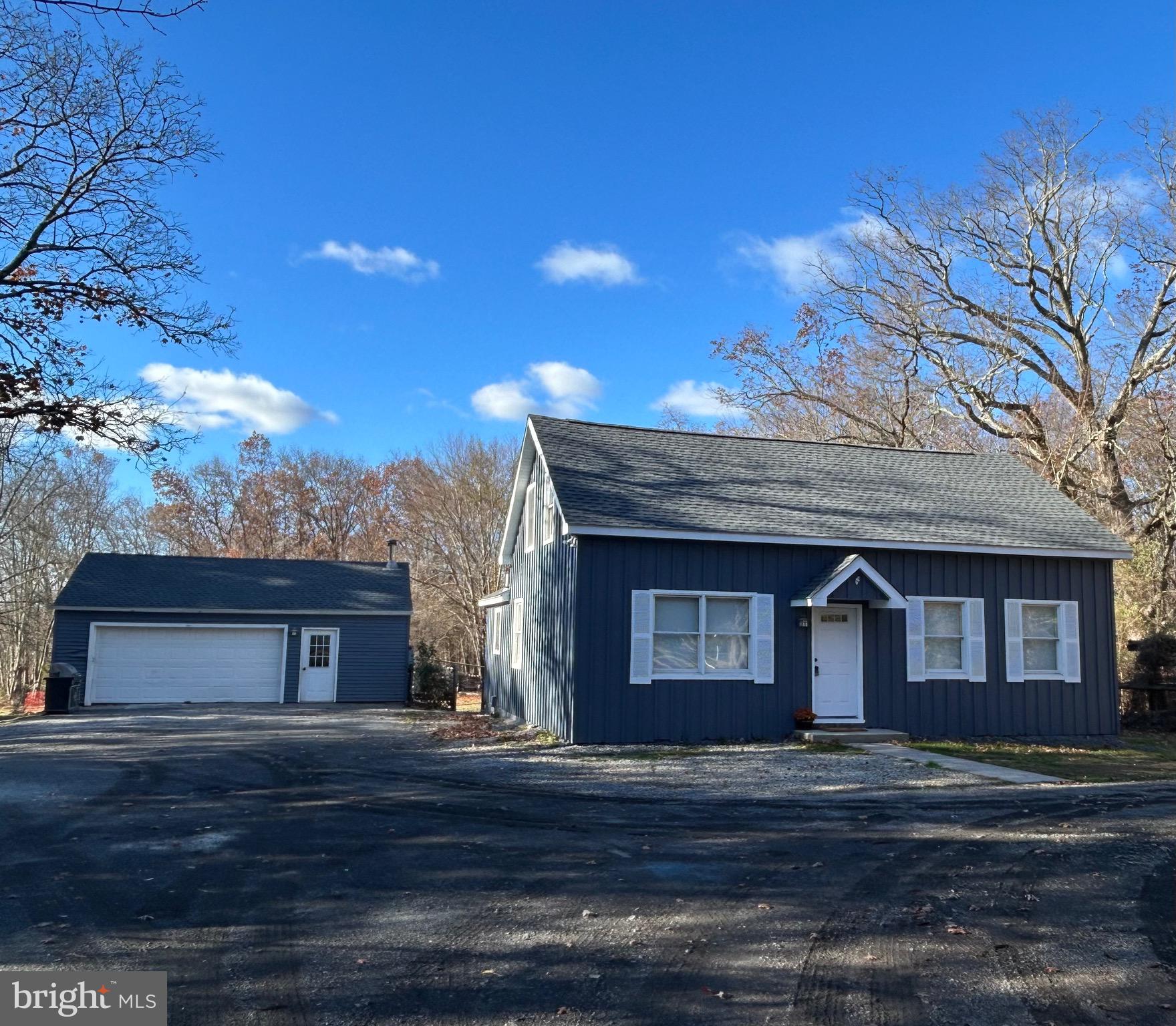 This deceivingly-large cape on 6.3 acres will surprise you, not just for its size but also for the flexibility its floorplan affords. The main floor offers a living room, kitchen with breakfast area, a large bedroom, a study and full bath with laundry facilities. The second floor has a loft area, currently used as a family room, two bedrooms, and a full bath. A deck off the back door overlooks a fenced-in area. Although there are many beautiful trees buffering the back of the property, there is ample cleared space for gardening, or a game of volleyball or baseball. A detached oversized two-car garage is a dream come true for an auto enthusiast or a woodworker and is the perfect place for securing your kayak, four-wheeler or tractor. There is so much parking space! Brand new roof! Zoned Village Center; check with the Township for allowable uses. House needs updating, but it is impossible to find a home on this large of a lot in Buckingham at a price this fantastic. Central Bucks Schools.