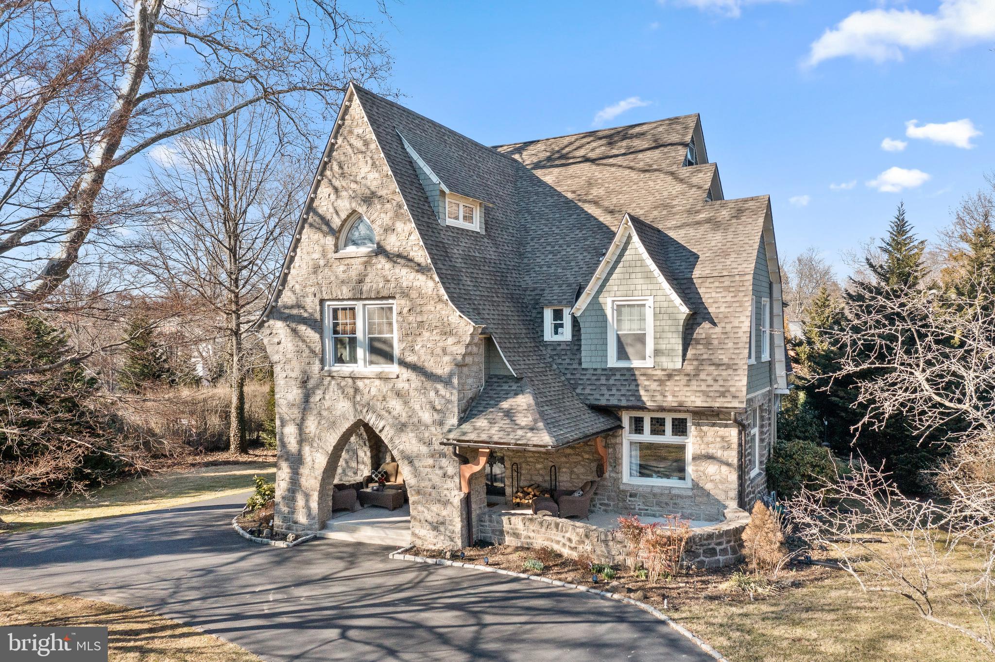 Fabulous Walk-to-Wayne location! This beautiful home is located in popular St Davids, South Wayne, and is a short walk to all of the wonderful restaurants and boutiques that downtown Wayne has to offer. Award winning Radnor Township schools, and a warm sense of community in historic downtown Wayne make this spot so special.
Welcome to 437 Midland Ave, a stately location on one of Wayne’s sidewalk lined, most desirable streets. Pull into the large belgium block horseshoe driveway and you are immediately welcomed by the gracious stone front porch. As you enter the very chic foyer, you will immediately be amazed by the high ceilings and deep window sills, intricate millwork, handsome hardwood floors, and the very dramatic 3 story stairs. It is impossible not to notice that the entire main level was renovated in 2013. The whole floor plan was renovated to make this historic home open and modern - exactly what today's buyers are hoping to find. Upon entering, the open foyer is central to the comfy formal living room with fireplace, and dining room with large original leaded windows. Off of the entry is a powder room and the main stairs. Heading toward the back of the house there is a large, open-concept family room and newly remodeled island kitchen and breakfast room. The kitchen has double thick Quartzite countertops, Thermador stainless steel 6 burner range with griddle, Bosch stainless dishwasher, Sub Zero paneled refrigerator, and built-in microwave, along with island seating for 4 or 5 people. The kitchen also has a breakfast room and an area for a wine bar. Tucked in immediately off of the kitchen is the most inviting outdoor space, which is protected by walls that offer the cozy feel of a special little private haven. Also off of the outdoor area is a back deck with a hot tub that leads you to the large flat lawn, with a custom built in gardners shed that provides lots of great storage.
Upstairs on the 2nd level there are 4 bedrooms with a very large landing area/main hallway featuring very stylish wainscoting. The Main bedroom suite is enlarged and renovated with a bedroom, sitting room, dressing area, extra large walk-in closet and en-suite bathroom with double sinks in the vanity, and a private screened in porch overlooking the side yard. Also on the 2nd floor are 3 additional bedrooms, a renovated hall bath and upstairs laundry.
The main dramatic staircase continues to wind all the way up to the 3rd Floor: Upstairs you will find 2 bedrooms and a gym/office space which could also be a bedroom if needed, as well as one renovated full bath.
This home has a new roof, new windows, this seller did the driveway expansion, the fence, all decks and patios, new garden shed, whole house generator, new cement porch with wood ceiling, conversion from oil to natural gas, built in speakers, new high velocity air conditioning in 2013, acid washed and repointed all stone and exterior trim repainted in 2020.
This neighborhood offers so much convenience, and also so much privacy. This is a true Main Line Dream House!