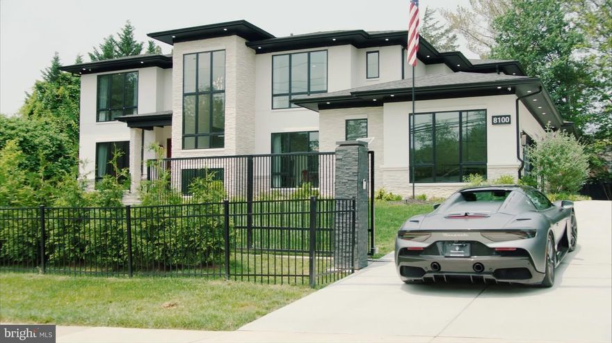 All furnishings convey - Luxury in the Heart of McLean moments from Tysons Corner and downtown Washington, this impressive modern residence is the embodiment of timeless design and refined living. Originally crafted by an award-winning architectural team, the home has been thoughtfully expanded and enhanced by its current owners to offer more than 8,000 square feet of luxurious living space, enriched by a curated selection of high-end upgrades. Set on a premium site behind a private, gated entry, the property offers a rare sense of privacy and sophistication just minutes from the vibrant center of McLean.
Inside, floor-to-ceiling windows flood the interiors with natural light, highlighting wide-plank imported wood flooring, elevator that services all floors, designer lighting, and bespoke finishes. The open-concept layout creates a seamless flow, ideal for both large scale entertaining and relaxed everyday living.
The chef’s kitchen is a true culinary statement—outfitted with Sub-Zero and Wolf appliances, dual dishwashers, custom German Rehau cabinetry, and a built-in Miele espresso system. The space opens to a sunlit breakfast area and a central family room anchored by a sleek linear gas fireplace, custom built-ins, and walls of glass leading to an expansive stone terrace and landscaped yard—complete with a newly completed, heated pool with a retractable power cover.
A bright home office, versatile guest suite (or second office), a designer mudroom with built-ins, and a full bath/dog wash complete the main level. A dramatic floating staircase introduces the upper level, where generously sized en-suite bedrooms feature walk-in closets, imported cabinetry, and stunning baths. The expansive primary suite is a private retreat with floor-to-ceiling windows, custom closets, a private coffee bar, and a spa-style bath designed to indulge.
The lower level offers 10-foot ceilings and an entertainer’s dream: a custom stone fireplace, wet bar, wine gallery, game area, home theater, large gym, and ample storage.
Outdoors, the private terrace overlooks the expansive green lawn and sparkling pool.  The newly completed pool is a perfect summer destination with an adjacent outdoor pavilion featuring a covered bar with whimsical seating and festive lighting.  Additional highlights include a 3-car side-load garage with epoxy floors, glass-panel remote-controlled doors, a 230V EV outlet, and room for lifts. Smart home features abound including an electronic entry system, Lutron lighting, in-ceiling speakers, mood lighting, full security camera coverage, an electronic entry, whole-house surge protection, generator pre-wiring, and CAT 5 wiring. Exterior upgrades include new landscape lighting and a full irrigation system.
Located within the area's top ranked Langley High School pyramid, this immaculate residence provides walkable access to the Spring Hill Recreation Center and close proximity to McLean, downtown Washington, and the region's airports. This is a rare opportunity for a discerning buyer seeking exceptional architectural style, modern technology, and turnkey condition in one of McLean’s most desirable locations.