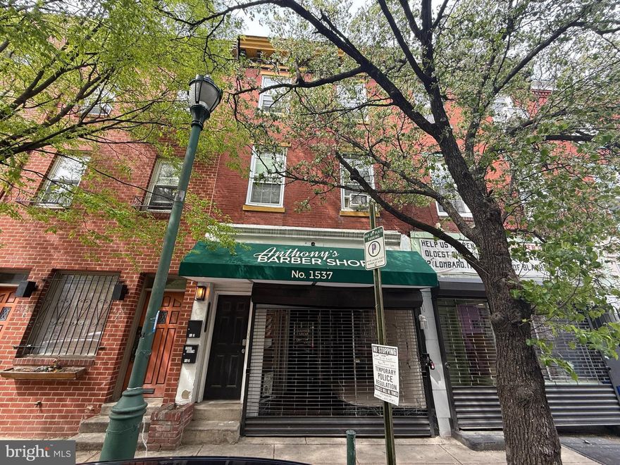 Excellent location to own a multi-unit in the most desirable destination of downtown Philadelphia.  This 4-unit commercial and 3 apartments are fully occupied.  The 1st-floor Commercial retail tenant is  lease 1,500. with a full basement on a Net lease.  The 2nd floor-bedroom apartment is currently occupied with a full kitchen and full bath.  The 3rd floor is also currently occupied as a one bedroom, kitchen, full bath.  The 3 units are at 1536 Rodman Street entrance behind(on Rodman Street) and this unit has HVAC, a full kitchen, a full bath, and a separate basement.  All units have laundry, hardwood floors throughout, and all updated tile bathrooms. All utilities are separated.  Conveniently, located within walking distance to all the center city has to offer, Best dining, shopping, Broad Street Subway line, etc. .  Do not disturb all the retail tenants and contact the showing agent for all questions and show.   All showings send POF before scheduling.