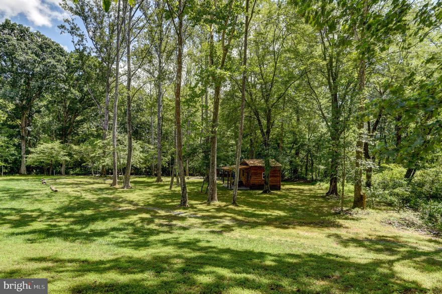 Located on 5.58 acres in the desirable Bedford Lake Estates, this property offers lake access for swimming, fishing, boating, and soaking in breathtaking mountain views. A 12x16 shed with a welcoming front porch (totaling 18x16 of usable space) was built in 2022, featuring a durable tin roof and set on a stamped concrete pad. A partial fence, also added in 2022, adds character to the outdoor space. Electric is onsite and ready to use. A new well, installed by Bedford Well in 2022, ensures reliable water access. Set along a peaceful creek, you can sit alongside and enjoy the relaxing sound of the babbling brookcreating the perfect setting for unwinding. This property blends privacy, natural beauty, and recreational amenities, all within one of the area's most sought-after lake communities.