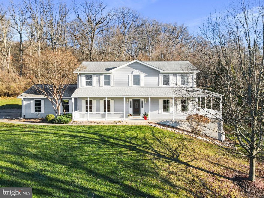 Welcome home to this stunning custom built large colonial on 6.10 unrestricted acres with breathtaking views for miles. Whether you have livestock, are the outdoor sportsman enthusiast, a car/motorcycle loving hobbyist, or you are looking for a peaceful retreat (or all four!) this is it. This gorgeous, 3,500 sq. ft. home boasts 4 bedrooms/2 full bathrooms/2 half bathrooms with an oversized attached garage along with an impressive climate controlled, detached 3 bay garage with lift and air compressor that are both included.  Gorgeous gourmet kitchen has stainless steel appliances, granite countertops, double wall oven and a cooktop with a built-in retractable downdraft range hood. Separate dining room for entertaining. Convenient main level laundry room. The primary bedroom suite has a sitting area, a walk-in closet, and features a tastefully updated private bathroom with double sinks, soaking tub, and separate stand-up shower. The other three bedrooms are very nicely sized and have plenty of closet space. Full, partially finished basement is at walk out level with huge family/entertainment room, gas fireplace, workshop, and a very spacious storage room.  Dual-zoned HVAC units were both replaced in spring 2023. Commuter friendly location within just a few miles of I-70 and I-270, and a quick and easy 10-minute drive to the MARC station.  This home truly checks off all the boxes. Don't miss your opportunity to own this gorgeous home and all the amenities that come with it. Schedule your showing today!