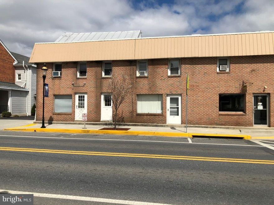 Investor Alert! Seven-unit apartment building with retail space currently a laundromat. Income-producing property has many long-term tenants.  Apartments are currently professionally managed at a very reasonable fee. The parking lot is located behind the apartments and laundromat and offers twelve parking spaces. A large shed is also on the property for additional storage. Recent improvements include a new roof. Conveniently located in downtown Emmitsburg.