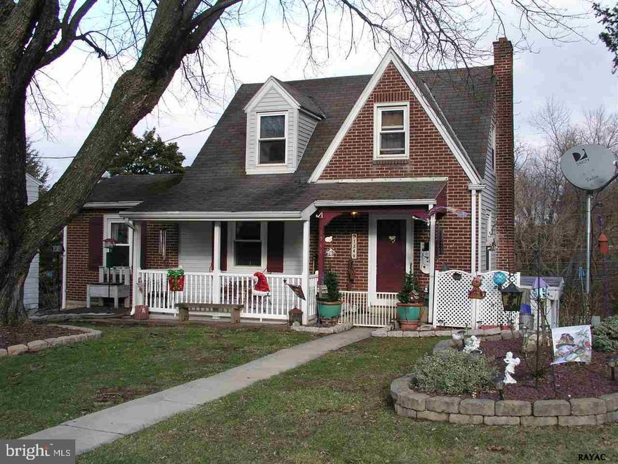 Curb appeal plus in this cozy home.  Hardwood floors throughout. Living room, dining room, kitchen with new floor.  First floor bedroom and full bath. Lower level family room with laminate floor and atrium doors to deck. Tons of storage in basement, former dark room for photography, workshop and garage.  Off street parking, fenced yard. Must see!!