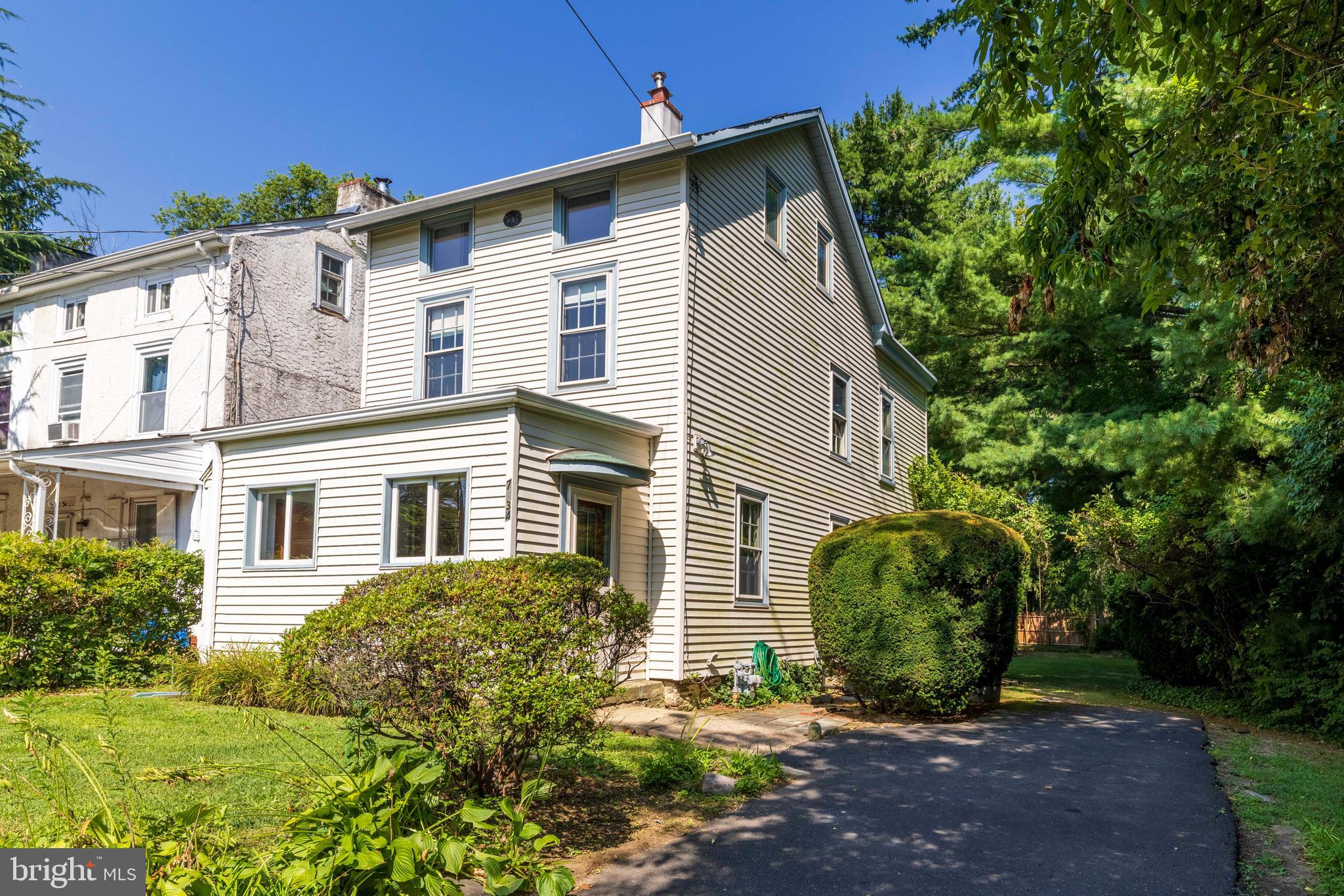 Welcome to this charming 3 story single home, blending timeless farmhouse interior with handcrafted craftsmanship. Originally built in the mid-19th century, this unique residence showcases uniqe architectural details alongside custom woodwork created by the owner, a master carpenter. Step inside to find original wide-plank yellow pine floors, exposed beam ceilings, and doors adorned with leaded glass panels. Sunlight pours through generously sized windows—many still featuring their original glass. Every corner of the home is enhanced by custom built-ins, including handcrafted cabinetry, shelving, vanities, closets, and one-of-a-kind lighting fixtures. The inviting kitchen is a perfect space for cooking, gathering and enjoying the natural light, it feature handcrafted cabinetry, stainless steel appliances, a center island, gas cooking, and lots of windows. Adding to the ambiance and charm of this wonderful space are the beamed ceiling and the leaded glass doors. A large deck overlooking the backyard is accessed by the kitchen's back door. The warm and welcoming living room flows seamlessly into the dining area and is accented by built-in bookcases and a custom-designed wall-mounted light fixture, adding a distinct artisan touch. Upstairs, the second floor offers a primary bedroom with a dressing area and two large closets, a second bedroom, and a hall bath complete with a clawfoot tub, walk-in shower, handsome vanity, and ceramic tile walls. The third floor provides two additional rooms a bedroom and an office, ideal for guests, a home office, or creative studio space. This one-of-a-kind home is a piece of history infused with artistic detail and craftsmanship throughout. An enclosed front porch with a large closet create additional space, and a large shed in the back yard affords great storage. Easy to show. immediate possession is possible.