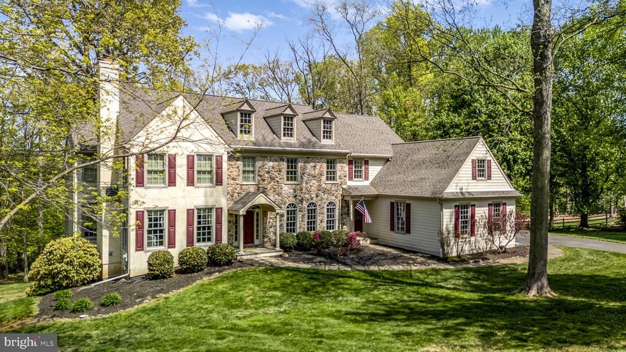 Welcome to 922 Copes Lane, a gorgeous home on a spacious 1.5 acre lot in the highly desirable West Chester School District. This updated, move-in-ready home is waiting for you to make it yours! Stroll up the beautifully landscaped walkway to the welcoming front entry. When you step inside, you are greeted by the grand, 2-story foyer boasting crown molding and wonderfully refinished red oak hardwood flooring that spreads throughout much of the home. Accessed from the foyer, the formal dining room offers an ideal space for hosting both large and small gatherings, while the formal living room boasts a cozy fireplace. Both rooms feature crown molding, with the dining room showcasing custom wainscoting. Upon entering the expansive kitchen, your attention is immediately drawn to the grand island, complete with a sleek breakfast bar. The space is further enhanced by an array of rich cherry cabinetry, granite countertops, propane cooking, double oven, Sub-Zero refrigerator, and a spacious pantry. The sunny breakfast area offers access to the rear deck overlooking the tree-lined backyard. Flow from the kitchen to the grand family room featuring a wall of windows, a vaulted ceiling and a propane fireplace. This open concept provides a great space for entertaining guests! The beautiful views continue into the home office that provides a quiet, productive space with plenty of natural light, perfect for working from home. The laundry room and 2 half baths complete the main floor. Ascend upstairs to the second story and find the impressive master suite boasting a tray ceiling, large sitting area, double walk-in closet, and a full master bath with a dual vanity, tiled shower and a soaking tub. The second bedroom offers separate access to the hall bathroom. The third and fourth bedrooms share a Jack and Jill bathroom and the fifth bedroom offers additional bonus space perfect for hobbying, exercising or working! Take advantage of the impressive, lower level in-law suite/apartment that offers a separate entrance, kitchenette, spacious living and dining areas with a cozy fireplace, a full bathroom, and a large bedroom. Outside of the home, enjoy the expansive wraparound deck, ideal for entertaining, with views of the yard featuring mature landscaping and bordered by protected lands. Additional features include: replacement Andersen windows and sliders, new carpeting, built-in sound system, fresh paint, mobile generator with easy connection to propane supply for powering the hot water, heat, refrigerators, and much more! Have piece of mind knowing the stucco has been completely remediated and the majority replaced with Hardie Plank Siding! Conveniently located close to all the fantastic shopping, restaurants, sports, entertainment, educational and medical facilities of West Chester Borough and the Upper Main Line area. This stunning home won’t last long!