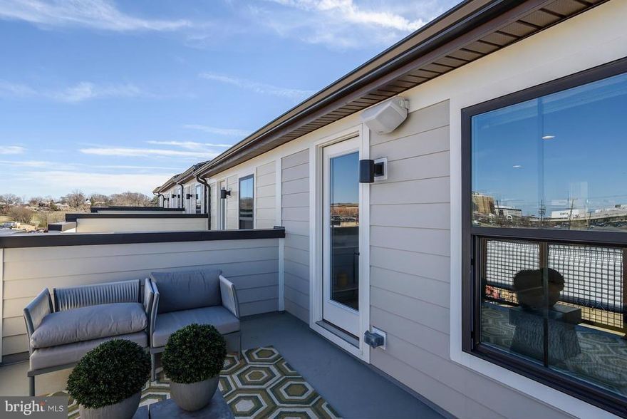 Talk about upgrades in this gorgeous end home! Urban in design; includes Hardwood, Quartz, Ceramic and more! Experience the serenity of the rooftop terrace. 5-minute walk to metro and easy access to major commutes. Limited time- receive ALL CLOSING COSTS PAID when financing w/ NVRM. Experience one of the hottest communities in the DMV! Pictures are representative only.