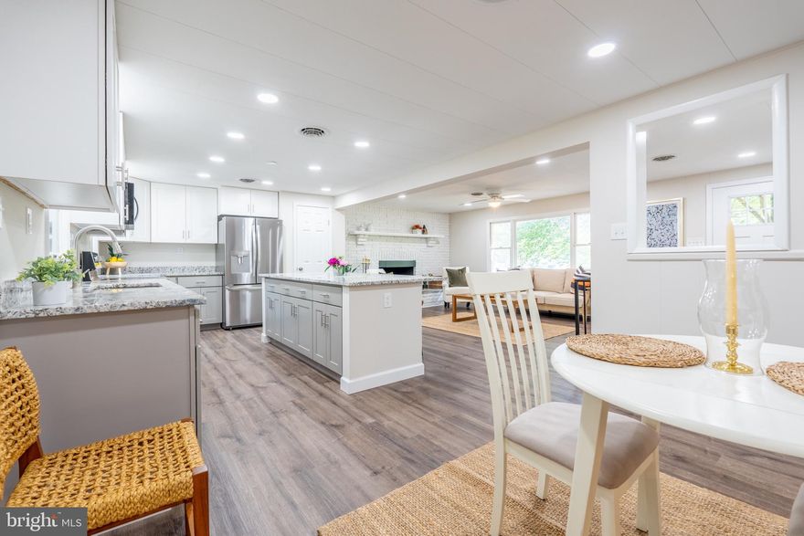 PRICE REDUCED!! Newly renovated & ready for it's new owner!!  Easy One-Level living with a LARGE lot, screened-in porch, fully finished lower level and is located within a water-access community with a dock, kayak launch, & pool!  Conveniently located with quick access to RT 50/97 & great schools. UPDATES & UPGRADES include:  NEW Kitchen, NEW Bathrooms, NEW Paint, NEW Floors, NEW Lighting, and more!! This 3 Bedroom, 3 Full Bathroom home also features a private office  space/ 4th bedroom / or exercise space, 2 wood-burning fireplaces, an oversized kitchen island with bar seating, stainless steel appliances and granite counters,  recessed lighting, and great natural light! You won't want to miss this one! OPEN HOUSE SUNDAY JULY 23rd, 2-4PM - Please join us!