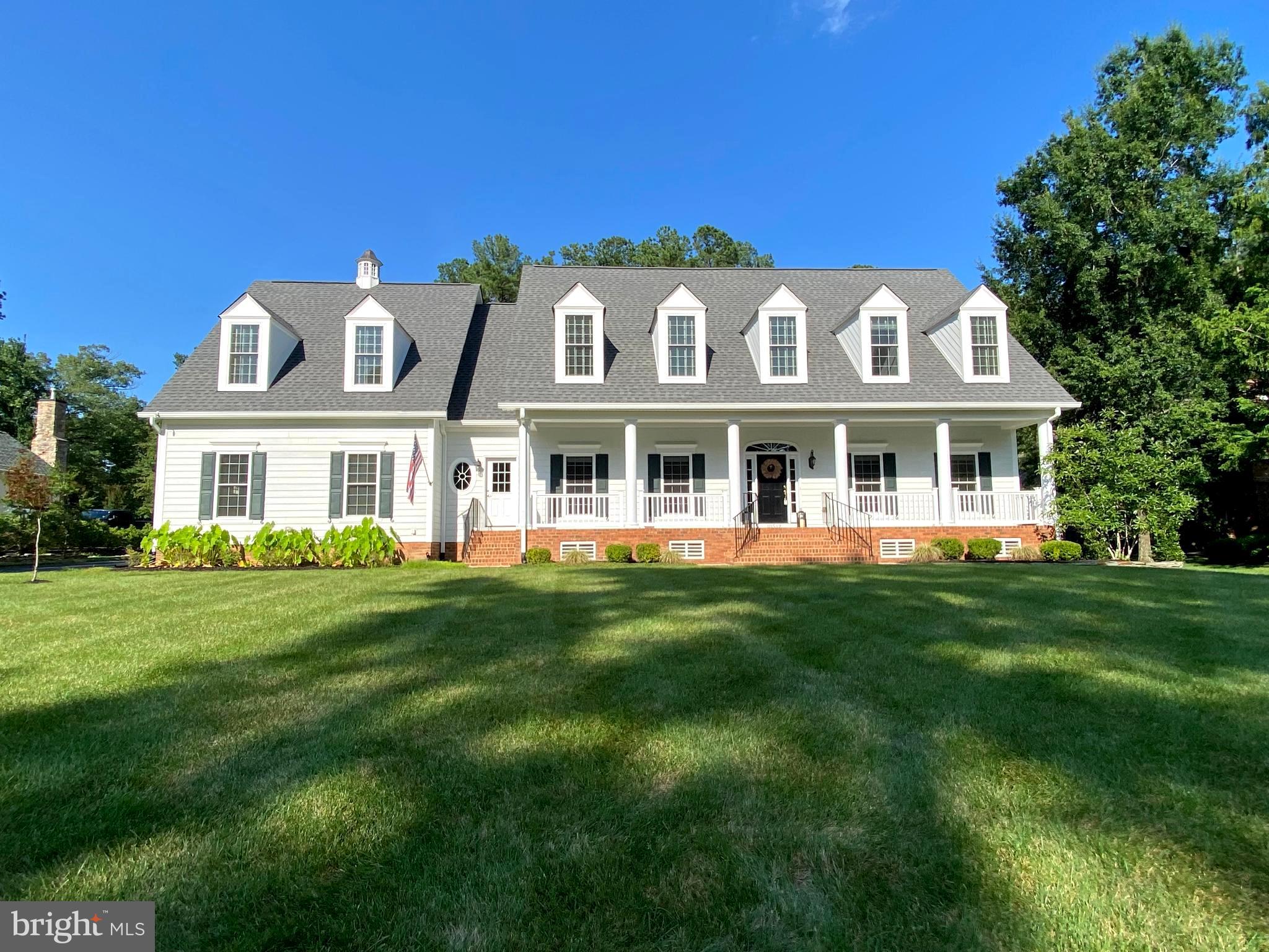 Located in the luxurious Fawn Lake gated Community, this Gorgeous Dream Home is perfectly positioned overlooking the 14th green of the scenic Fawn Lake Golf Course! This classic Cape Cod was designed and built with superior craftsmanship for elegant yet casual living and entertaining by Fairway Custom Homes.
Exuding curb appeal and timeless Southern charm, this stunning residence greets you with a sprawling lawn and an expansive yet welcoming front porch that beckons you to sit for a while. The sunlight interior is graced with stunning architectural details, timeless luxury amenities, large windows, hardwood floors, rich wood accents, arched doorways, coffered ceilings, and artfully curated living spaces filled with abundant comforts and beautiful design elements. The elegant Foyer is anchored by a beautiful Living Room with built-in bookcases, and a gracious Formal Dining Room for hosting dinner parties.
A spectacular Family Room with coffered ceilings, features a gas fireplace and floor to ceiling windows offering views of the peaceful backyard and the scenic fairway just beyond. The amazing Gourmet Chef's Kitchen is equipped with upgraded cabinetry, stainless steel appliances, granite counters, built-in buffet, Butler's Pantry with Wine Bar and beverage fridge, and a large center island. The adjoining breakfast area with a spectacular stone fireplace adds character and warmth, providing an inviting atmosphere to prepare meals and entertain with family and friends.
French doors lead to the inviting Screened Porch, which offers tranquil vistas and expands the living space even further.
Upstairs, the gracious Primary Suite is a private sanctuary featuring its own fireplace, two large walk-in closets, a luxurious Spa Bath with fireplace, and a private balcony for enjoying the incredible vistas. Two additional Bedrooms with ensuite baths and walk-in closets are each thoughtfully designed with style and privacy in mind. A large versatile Bonus Room completes the upper level, which is conveniently accessed via a private staircase that leads to the secondary front entrance.
Designed for entertaining, the expansive Basement features a large Recreation Room with an incredible custom built Wet Bar. Two gracious Bedrooms sharing a large bath offer privacy and comfort for guests.
Boasting custom elements at every turn, the Home is even equipped with an elevator shaft!
Park-like grounds designed for enjoying nature and maximizing outdoor living and entertaining, highlight the exterior of the property. The flat, fenced backyard with a sprawling manicured lawn is bordered with large trees offering a canopy of shade and privacy, while overlooking the rolling fairway. The beautifully landscaped yard is easily maintained by the underground irrigation system. An oversized 3-Car garage with extended driveway provides ample parking.
Located in a desirable established section of Fawn Lake that features tree-lined streets with sidewalks for enjoying daily walks and meeting friends. Recent updates include: newly refinished hardwood floors, new stove and fresh paint! **Seller is offering an Assumable VA Loan with a 2.375% interest rate for huge savings!** Plus a transferrable Country Club Golf Membership available ! It's time to start living and enjoying the Fawn Lake Lifestyle!
*The beautiful Luxury Fawn Lake Community offers amazing amenities such as a boating recreational lake, beach, an Arnold Palmer designed Golf Course, tennis courts, baseball and soccer fields, dog park, volleyball courts, walking trails, Community Club House, marina, fitness center, restaurants, Country Club, playgrounds, and so much more! Located in the countryside near Fredericksburg, VA surrounded by parklands and only a few miles to the farm market, wineries, and award winning breweries! Conveniently located to shopping, restaurants, top-rated Riverbend District schools and I-95!