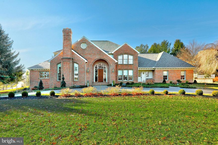 Exceptionally appointed custom brick home with over 5,000 SF located in prestigious Wyndham Hills. Custom built by EG Stoltzfus, this one-owner home was meticulously cared for!  As soon as you enter the home, you'll notice the quality, well crafted features.  The first floor has 9' ceilings throughout with a 2-story ceiling in the foyer and family room.  Gourmet kitchen with oversized center island and dining area with access to covered patio area that's perfect for entertaining.  The family room features a gas log fireplace, built-in entertainment center, wet bar, Palladian windows and opens to an additional patio. Separate formal dining room for those special gatherings, sunken living room with additional gas log fireplace and custom built bookshelves.  First floor master suite with sitting area and two walk-in closets. Spa-like master bathroom with whirlpool soaking tub, walk-in tile shower and dual vanities.   Additionally, the first floor offers a nicely appointed office, convenient laundry room and half bath.   Accessible by two different staircases, the second floor features four large bedrooms, with two sharing a convenient Jack and Jill bathroom, additional full bath and plenty of storage.  The finished lower level has a large rec room with built-in entertainment area, gas log fireplace and wet bar, 6th bedroom and a 4th full bath.  Plenty of additional storage space and access to the 3 car garage.  Some recent updates include a new roof, HVAC and landscaping.  Located in York Suburban School District and only minutes away from York Hospital, Apple Hill and two country clubs.