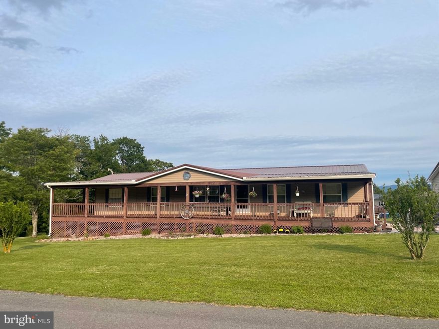 This 4 bedroom 2 bath single-level living awaits you on 1.09 AC with mountain views. Bonus room could be made into a fifth bedroom, family room, or office. HUGE front deck that wraps around to a back deck. 3 car garage and an outbuilding. Complete with laundry room, and mud room. Huge master bathroom with tub, shower, and walk in closet.  New kitchen appliances and countertops convey. ALL on single floor living! Need good internet? No problem. Shentel internet is available here. Schedule your showing today!