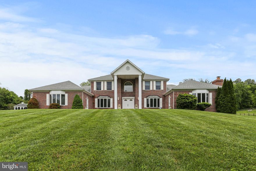 ✨ Back on the market, a rare estate reintroduced ✨ Experience refined living at 3547 Green Spring Rd. This is more than a home; it’s a lifestyle defined by space, privacy, and sophistication.Rare opportunity to own a stately Georgian Colonial on over 5 acres in Havre de Grace; designed for versatility, multi-generational living, and elevated comfort. This expansive 8-bedroom, 5.5-bath home is thoughtfully configured with three distinct living areas.

The main residence features a traditional center hall layout with formal living and dining rooms, a large country kitchen with maple cabinetry, black appliance package, and a spacious family room with brick fireplace. Upstairs includes four generously sized bedrooms, including an owner’s suite with private sitting room, walk-in closet, and spa-like bath with soaking tub and separate shower.

On one side of the home, a side-load garage leads to a wing with two main-level bedrooms, full bath, and convenient access to laundry and kitchen; perfect for guests or single-level living. On the opposite wing, a fully self-contained, handicap-accessible 2-bedroom in-law suite offers a private kitchen, large shared bath, laundry, and cozy living room with its own fireplace and bay window. Whatever your need for additional independent living space this one accomplishes the task like few homes do. The attached garage has a second exit door that leads to the front of the home and the main entrance to the second home creating. 

The finished lower level includes a large rec room, full bar, bonus space, and walk-out access; ideal for entertaining or home business potential. Outside, enjoy mature landscaping, fenced garden area, and a massive 30’x60’ outbuilding with 4 10'x12 doors with the last bay extended an additional 12' to accomodate a motorcoach.

Whether you need room for extended family, live/work flexibility, or hobby space, this home stands apart with its scale, layout, and adaptability.