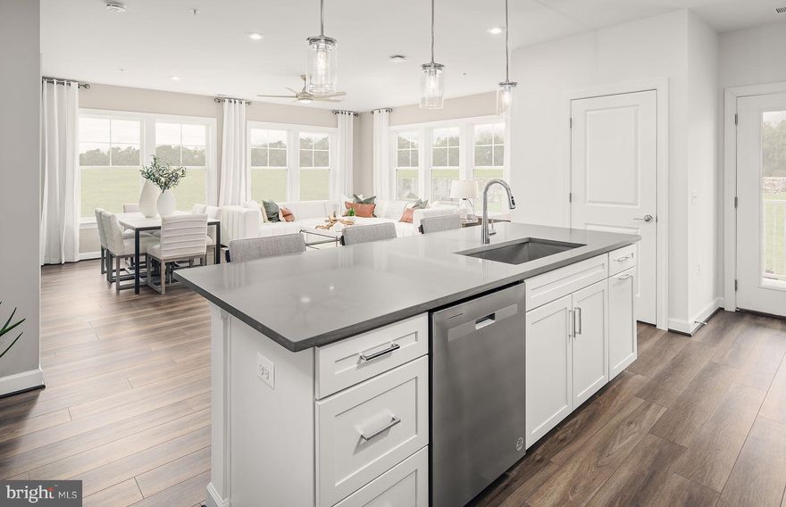 Two sides of windows provide the Avery corner unit with sunlit rooms. This home balances open entertaining spaces and privacy.