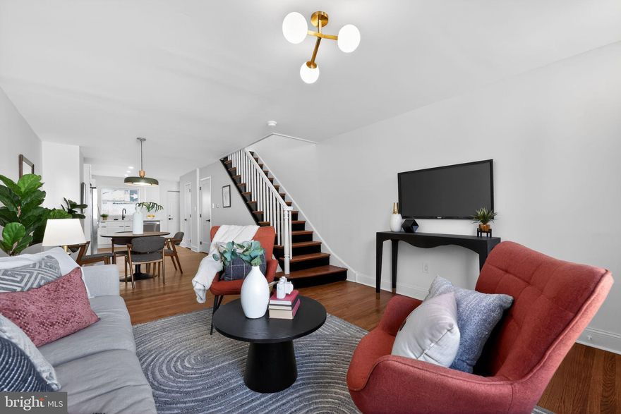 Welcome to this beautifully renovated 3-bedroom, 1.5-bath rowhome in the heart of Passyunk Square. This home perfectly blends old-world charm with modern updates, featuring refinished original hardwood floors alongside quartz countertops, a tile backsplash, stainless steel appliances, recessed lighting, and stylish fixtures throughout. A convenient half bath has been added to the first floor for everyday ease. Upstairs, you’ll find three generously sized bedrooms offering comfortable living space and flexibility for a variety of needs. The hallway bathroom has been tastefully updated with modern tile, a sleek vanity, and contemporary light fixtures. The exterior has been freshly updated and painted, and the private, walled rear patio offers the perfect space for grilling and outdoor entertaining. Located just one block from local favorites like Cosmi’s Deli, Tesiny, Termini Brothers Bakery, and other neighborhood staples, you’re also just a short walk to Passyunk Avenue’s vibrant shopping and dining scene, as well as the Broad Street subway line for easy commuting. Don’t miss the opportunity to own a move-in-ready home in one of Philadelphia’s most sought-after neighborhoods! The listing agent has an equitable interest in this property.