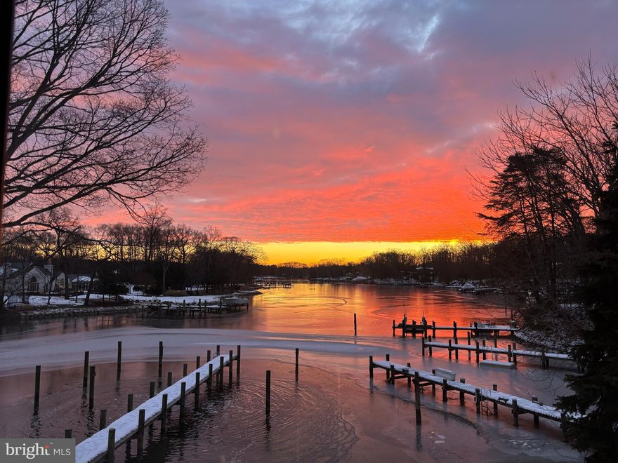 Beautiful waterfront home on Whitehall Creek in the sought-after Amberley community. Every detail in this perfectly designed home has been thoughtfully curated by local interior designer. The 5 bedrooms and 3.5 baths provide ample space for a large family, friends and guests and the bonus room with built-ins makes a great home office, library or play room. An open floor plan encompasses the Gourmet Kitchen with island and full size side by side refrigerator/freezer, the dining area and the Living room which features stone fireplace and soaring vaulted ceiling.  Step out to the spacious waterside deck spanning the entirety of the length of the home and relax in the perfect spot for enjoying the waterfront lifestyle. The Primary bedroom suite is filled with natural light and the spa-like bath boasts playful yet elegant finishes with a perfectly placed soaking tub to take in the magnificent views down Whitehall Creek. The lower level houses 2 spacious bedrooms with shared bath, laundry room and cozy family room with fireplace. Sliding doors lead to the patio and out to the private pier. Head out for a day on the water on the Chesapeake Bay and beyond. This home is perfectly situated on a large lot and set back off the road creating a feeling of privacy within a wonderful family friendly community. The Amberley neighborhood boasts 3 community piers on Whitehall and Ridout creeks with easy access to the Chesapeake Bay, Annapolis, and the Bay Bridge, you can enjoy boating and fishing on the Bay, as well as walking, jogging, and bike riding along the scenic roads and trails which meander through the neighborhood. Located in the award-winning Broadneck school district and with easy access to RT 50, Annapolis, shops and restaurants. Welcome Home!