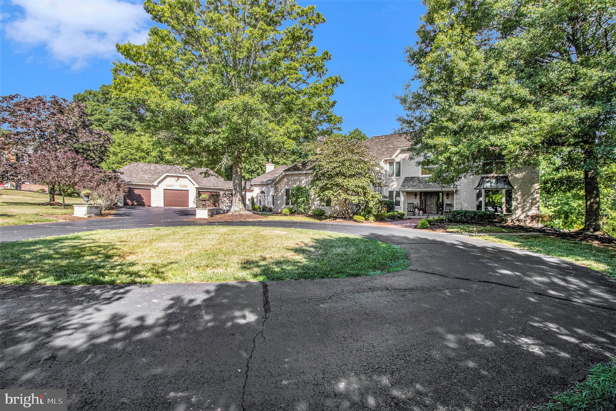Welcome to this hidden gem in Towamencin Township. Driving into the private Cul-de-sac you will be immediately stunned by this stately home that will be directly ahead and can be entered by the circular driveway or one of the attached 5 car garages. This stunning home features close to 5000 sq ft plus 5 gas fireplaces. As you step thru the elegant entryway you are greeted by a grand foyer with gleaming hardwood floors and high ceilings. There is a private office to your right which features a gas fireplace and a spiral staircase which leads up to the master bedroom. As you stroll thru the foyer you will enter the beautiful dining room with an expansive greenhouse window overlooking the stunning rear yard. There is a large double-sided stone gas fireplace that separates the dining room and living room. The living room exudes warmth making it a favorite place to relax and enjoy the stunning views of the private surroundings. This kitchen is the center of the home and an entertainers delight featuring electric cooktop, updated cabinets and a huge center island with two ovens! The countertops are marble and feature beautiful black tile surround. Guests will be surely impressed! The open concept area leads to the inviting family room which has the 3rd gas fireplace on this level. There is a hallway leading from the attached 2 car garage which enters off of this area which includes a large coat closet, laundry room with ample storage and a beautiful powder room. As you enter straight back from the kitchen you will find a full bath which leads to the back deck and pool making it convenient for all the swimmers. Now the Creme de le Crème! The most luxurious Great Room that takes this home to the next level! Fourteen foot high ceilings with decorative beams and molding boast the elegance of this immense room. Entertaining at its finest with built-in full size hardwood bar with included stools, 4th gas fireplace and much more. Light flows freely in thru the many windows and French doors that lead to expansive deck and the rear yard. There is a door that leads to a breezeway that attaches to the 3car garage. The middle bay is oversized and can accommodate a limousine or longer classic car. The second floor feature the owners retreat with large newly redone bathroom featuring a large walk thru shower with 2 shower heads and an oversized walk- in closet. There are 3 additional bedrooms and a full bath on this level. Stepping outside in the warm months you will find a vacationer’s dream. The basement is approximately 1400 sq ft of finished area with a full bath that can be the perfect in-law suite, featuring a gas fireplace and living area with private entrance and patio. Private rear yard with salt water pool and hot tub which overflows into the pool. The expansive deck features a pergola to add adequate shade when dining. There is a built-in grill and small refrigerator for all of your cooking needs. A Gas fireplace that will take the chill off on some of those cool summer evenings. An additional deck is placed in the shaded area of the pool for your cooler relaxing. This lot is very private and is over 2.2 acres. Newer shingle shake roof and much more. Don’t miss this amazing home!