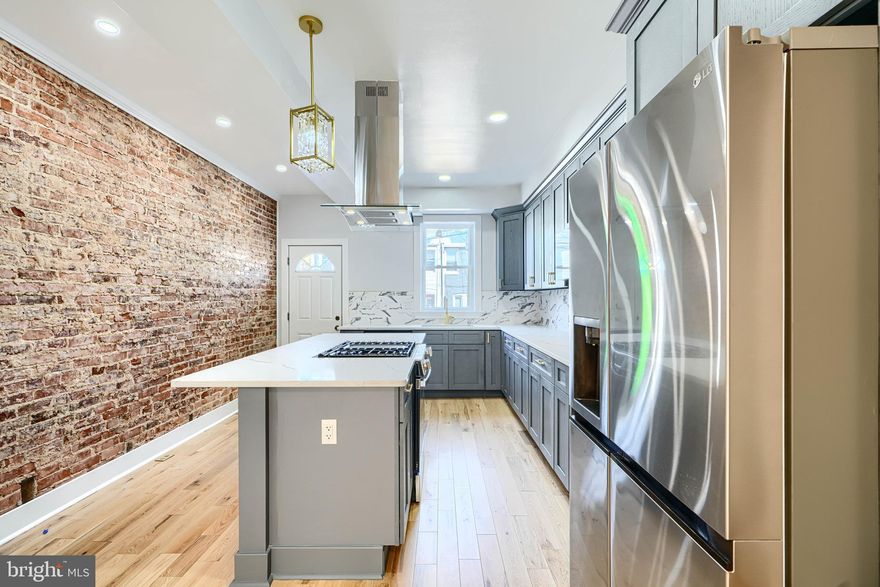 Full Renovation -Show and sell today!! All offers considered If you are looking in this location, this one SHINES!! Not the first rodeo for this contractor- Great work- Lots of new development around-Close to the Amtrack-Penn Station-Come take a look at this property- you'll fall in love-Dynamite kitchen- with Quartz countertops- so many cabinets and large island with cooktop and full hood exhaust-If you like to cook - this is your kitchen- Stainless appliances- exposed brick- Upgraded LED lighting throughout- Stylish finishes - with fabricated metal railings-Great Natural sunlight - New skylight= Full underpinned basement- All permits pulled - U and O available-Full fire escape egress- 2 bedrooms - full bath in basement- Large Master on second floor with additional bedroom- 2 Full baths on second level- Rain shower faucets- LED surround mirrors-no fog-Full sized washer/dryer- LVP floors throughout-Central A/C and heat- Take advantage of Baltimore City programs - free money- Close to Hopkins - LNWYW money- participating employers. Make your appointment today!! This property qualifies for NO MONEY DOWN 80/20 LOAN or FNB HOMEOWNERSHIP PLUS PROGRAM-talk to your lender and get free money towards closing costs