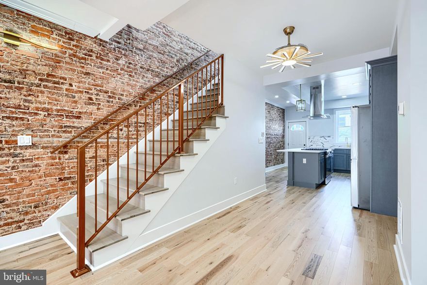 Interest rates are coming down and so did the price on this great RENOVATION!-Beat the competition before the busy spring market-   Get LNWYW money and your commute is only blocks away- Great work- Lots of new development around--Dynamite kitchen- with Quartz countertops- Lots of storage -large island with cooktop and full hood exhaust-If you like to cook - this is your kitchen- Stainless appliances- exposed brick- Upgraded LED lighting throughout- Stylish finishes - with fabricated metal railings-Great Natural sunlight - New skylight= Full underpinned basement- All permits pulled - U and O available-- 2 bedrooms - full bath in basement- Large Master on second floor with additional bedroom- 2 Full baths on second level- Rain shower faucets- LED surround mirrors-no fog-Full sized washer/dryer- wood floors -Central A/C and heat- Take advantage of Baltimore City programs - free money- . Make your appointment today!! This property qualifies for NO MONEY DOWN 80/20 LOAN or FNB HOMEOWNERSHIP PLUS PROGRAM-talk to your lender and get free money towards closing costs-Show and sell today!!