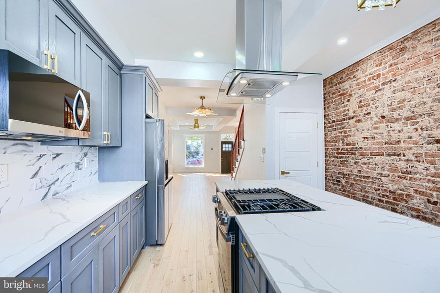 RENOVATION-Close to Hopkins- Could be great if you work at the hospital.  Get LNWYW money and your commute is only blocks away- Full Renovation -Show and sell today!!  If you are looking in this location, this one SHINES!! Not the first rodeo for this contractor- Great work- Lots of new development around-Close to the Amtrack-Penn Station-Come take a look at this property- you'll fall in love-Dynamite kitchen- with Quartz countertops- so many cabinets and large island with cooktop and full hood exhaust-If you like to cook - this is your kitchen- Stainless appliances- exposed brick- Upgraded LED lighting throughout- Stylish finishes - with fabricated metal railings-Great Natural sunlight - New skylight= Full underpinned basement- All permits pulled - U and O available-Full fire escape egress- 2 bedrooms - full bath in basement- Large Master on second floor with additional bedroom- 2 Full baths on second level- Rain shower faucets- LED surround mirrors-no fog-Full sized washer/dryer- LVP floors throughout-Central A/C and heat- Take advantage of Baltimore City programs - free money- . Make your appointment today!! This property qualifies for NO MONEY DOWN 80/20 LOAN or FNB HOMEOWNERSHIP PLUS PROGRAM-talk to your lender and get free money towards closing costs